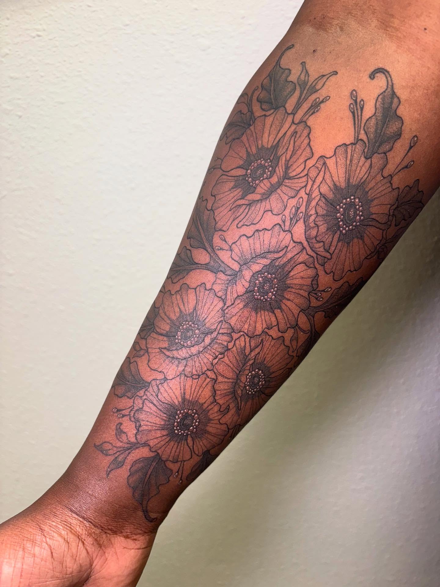 Poppy flowers dotwork tattoo on the forearm by Rachel Foster