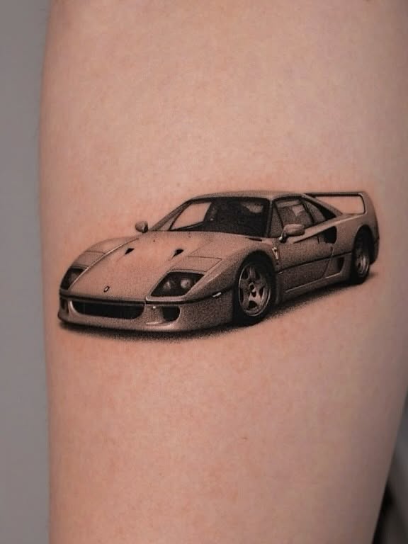 Ferrari f40 realism tattoo on the forearm by Aren