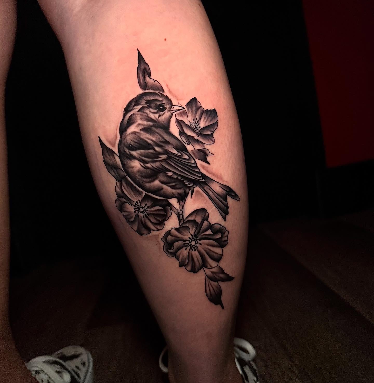Bird and flowers realism tattoo on the thigh by Ryland - Tattoo Artist