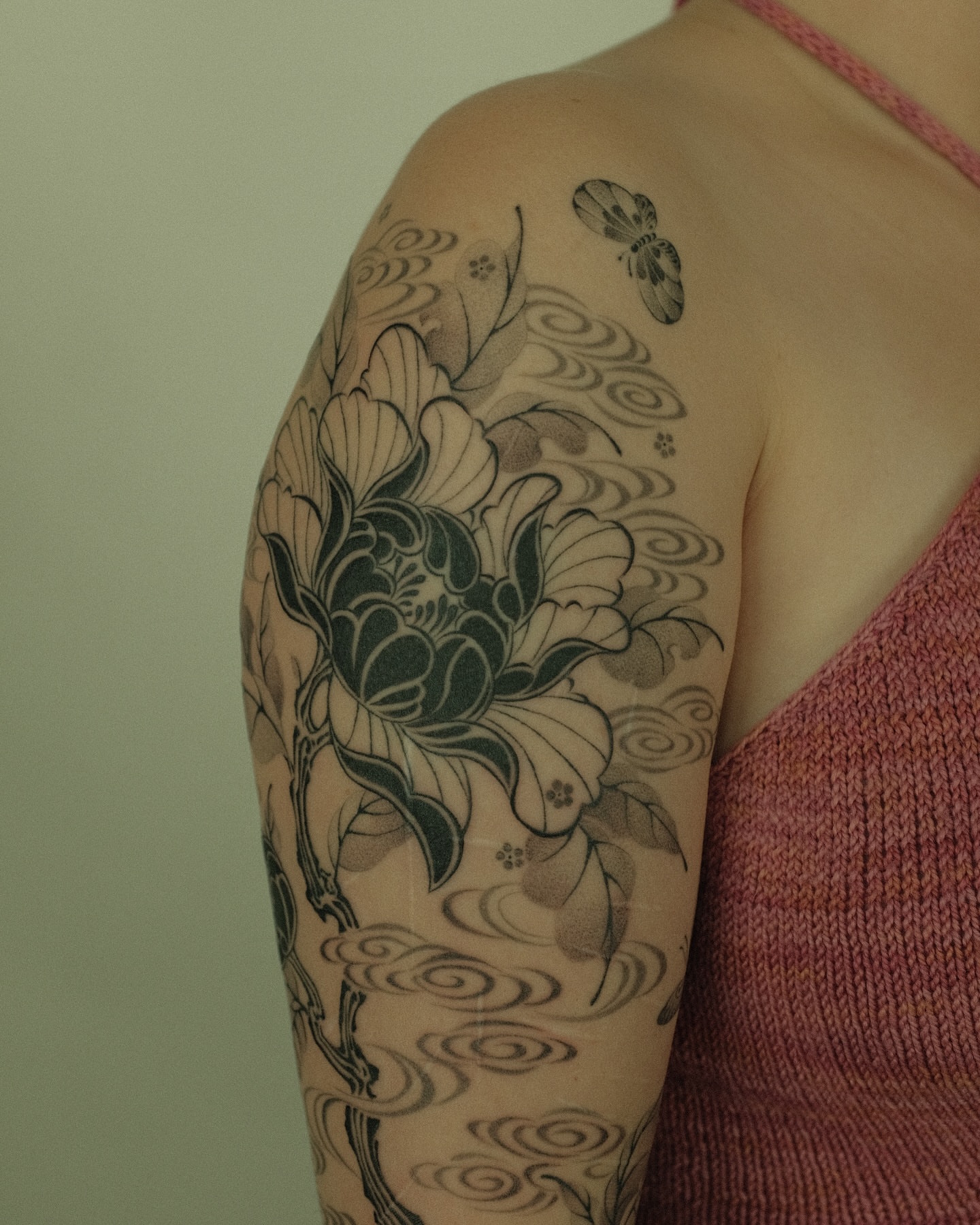 Peony flower japanese irezumi tattoo on the upper arm by Xiao Lun