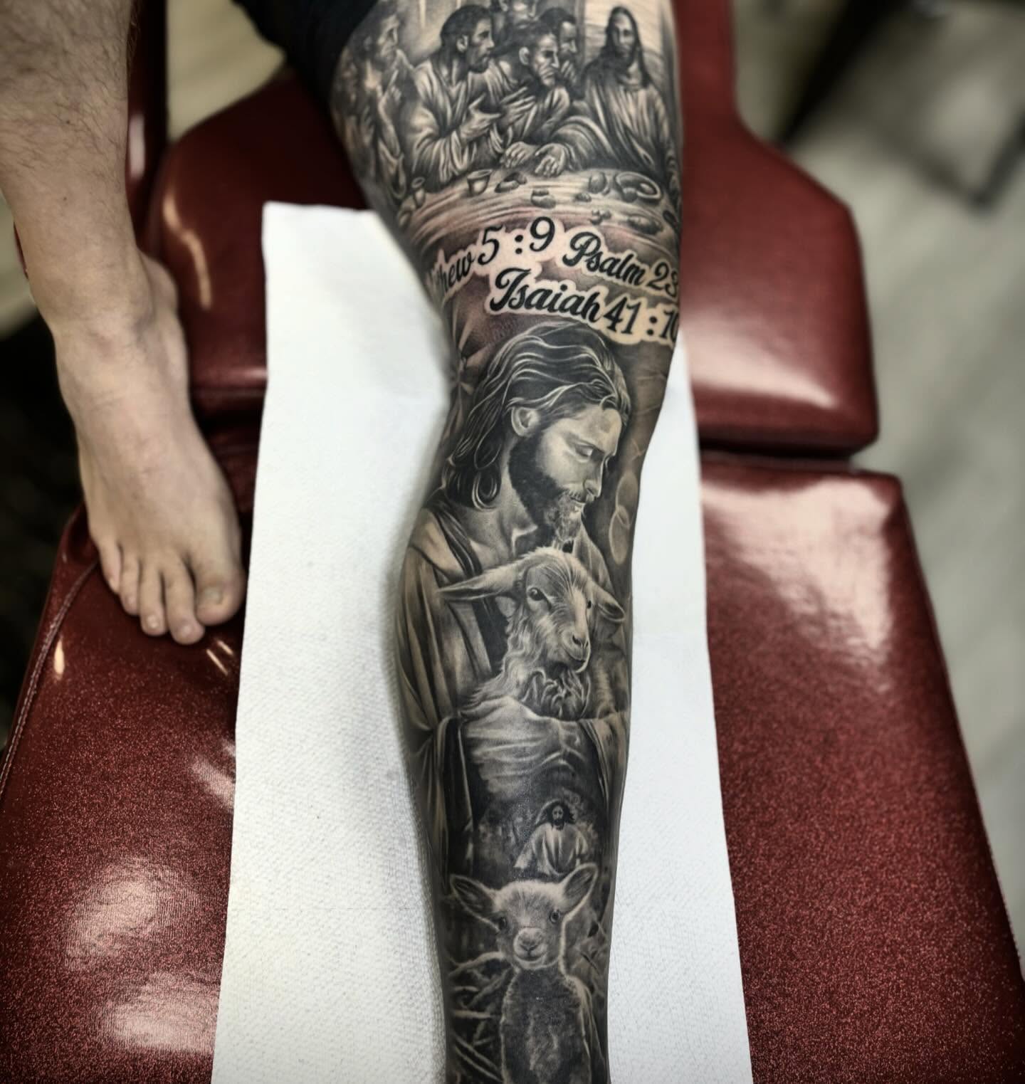 Religious figures and sheep realism tattoo on the forearm by ๐๐๐๐๐๐๐ ๐ฌ.๐ผ