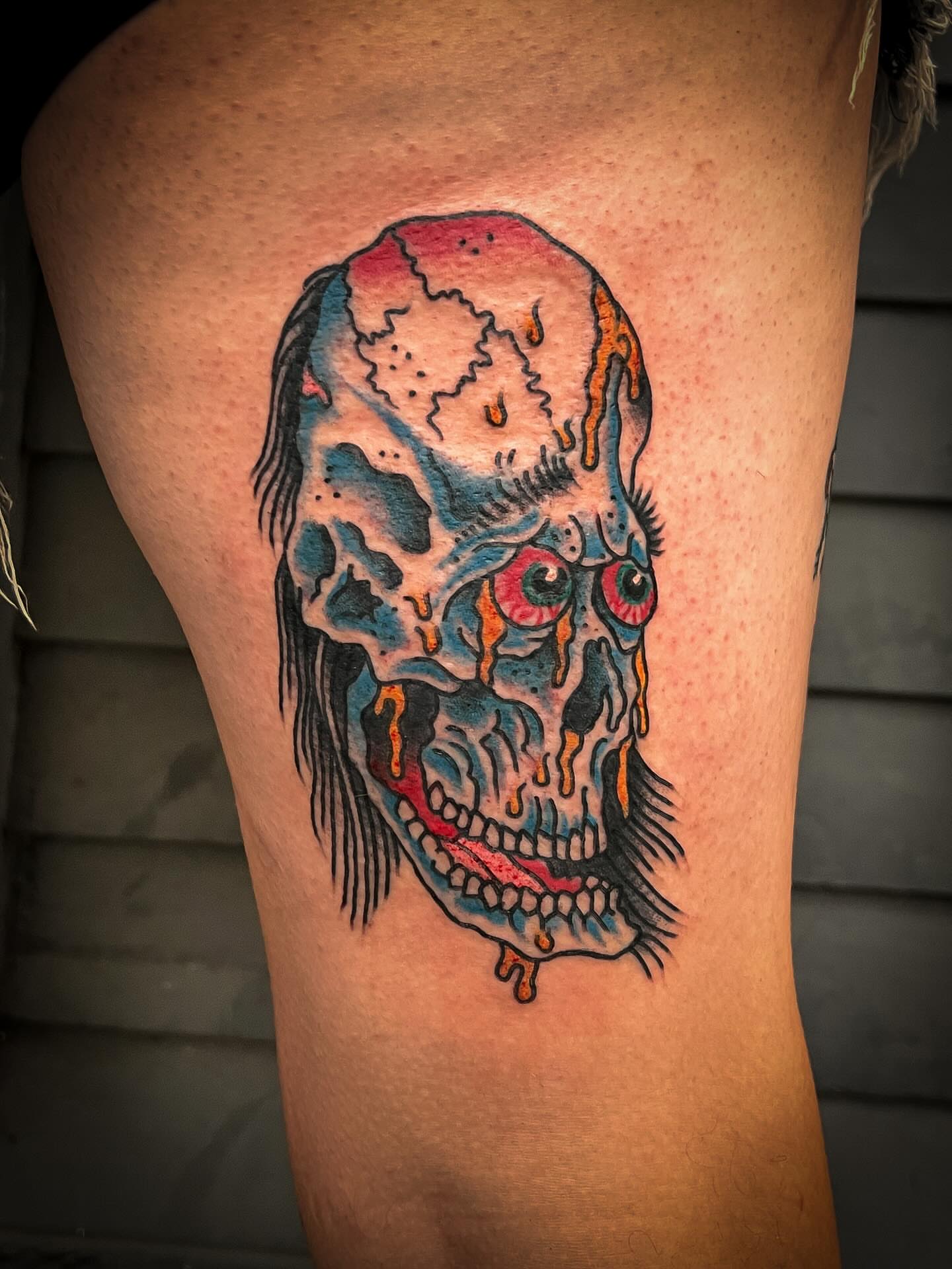 Skull realism tattoo on the thigh by Scott Allen