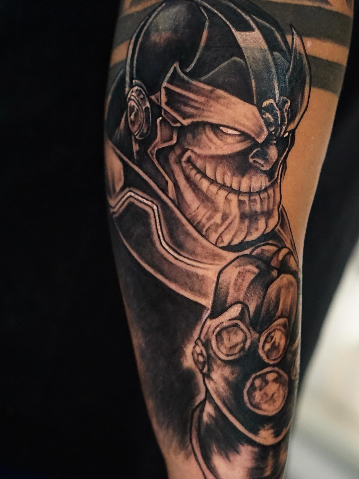 Thanos dark realism tattoo on the forearm by Nicholas Capellan, Winter Park, Florida