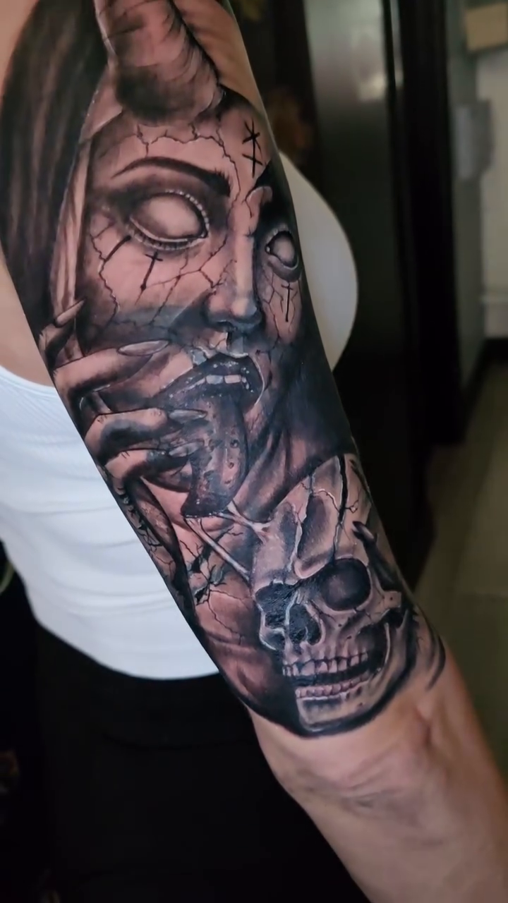 Demonic woman and skull dark realism tattoo by Jesse James, Las Vegas, Nevada