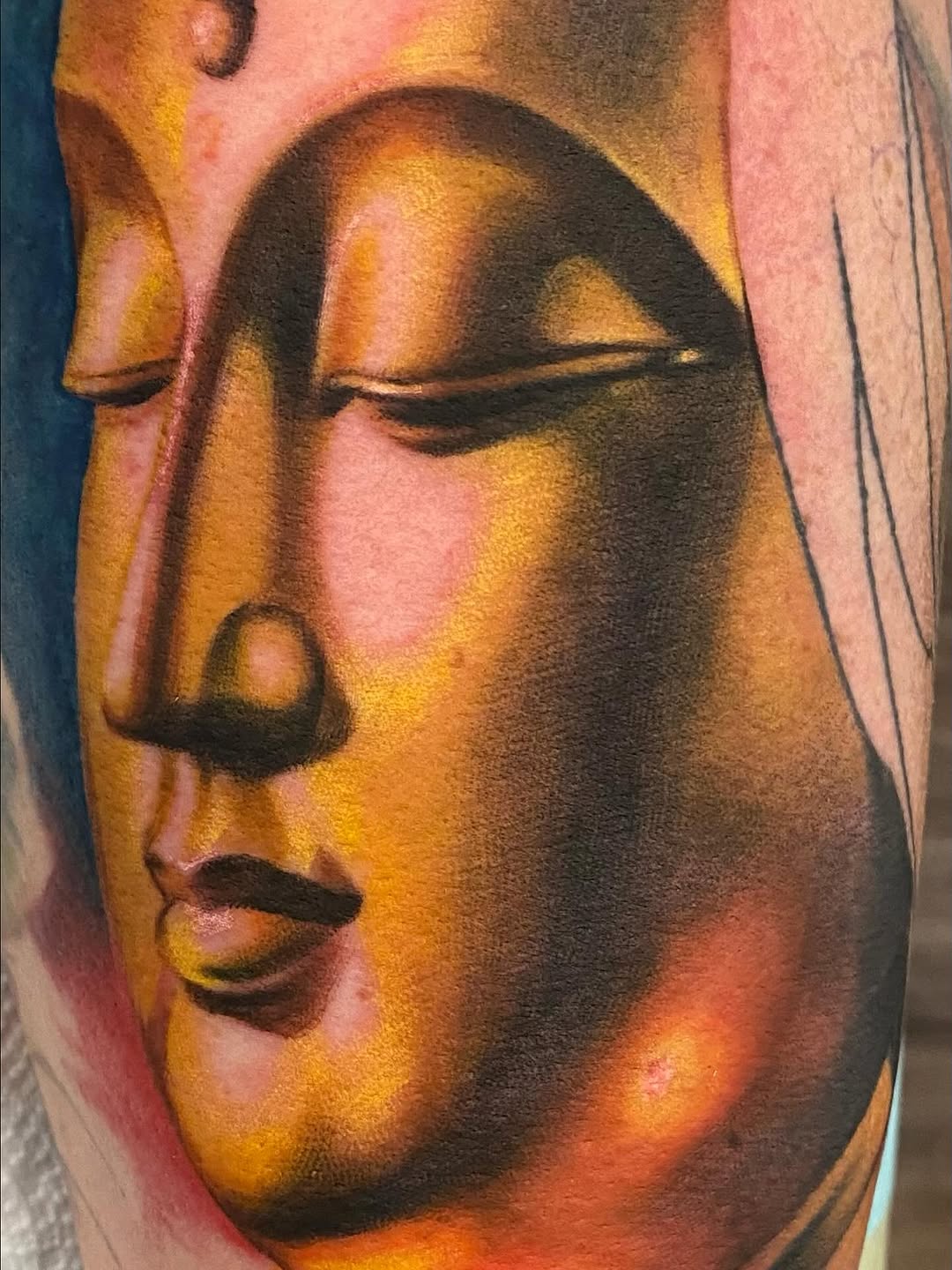 Buddha face surrealism tattoo on the forearm by @doctorze