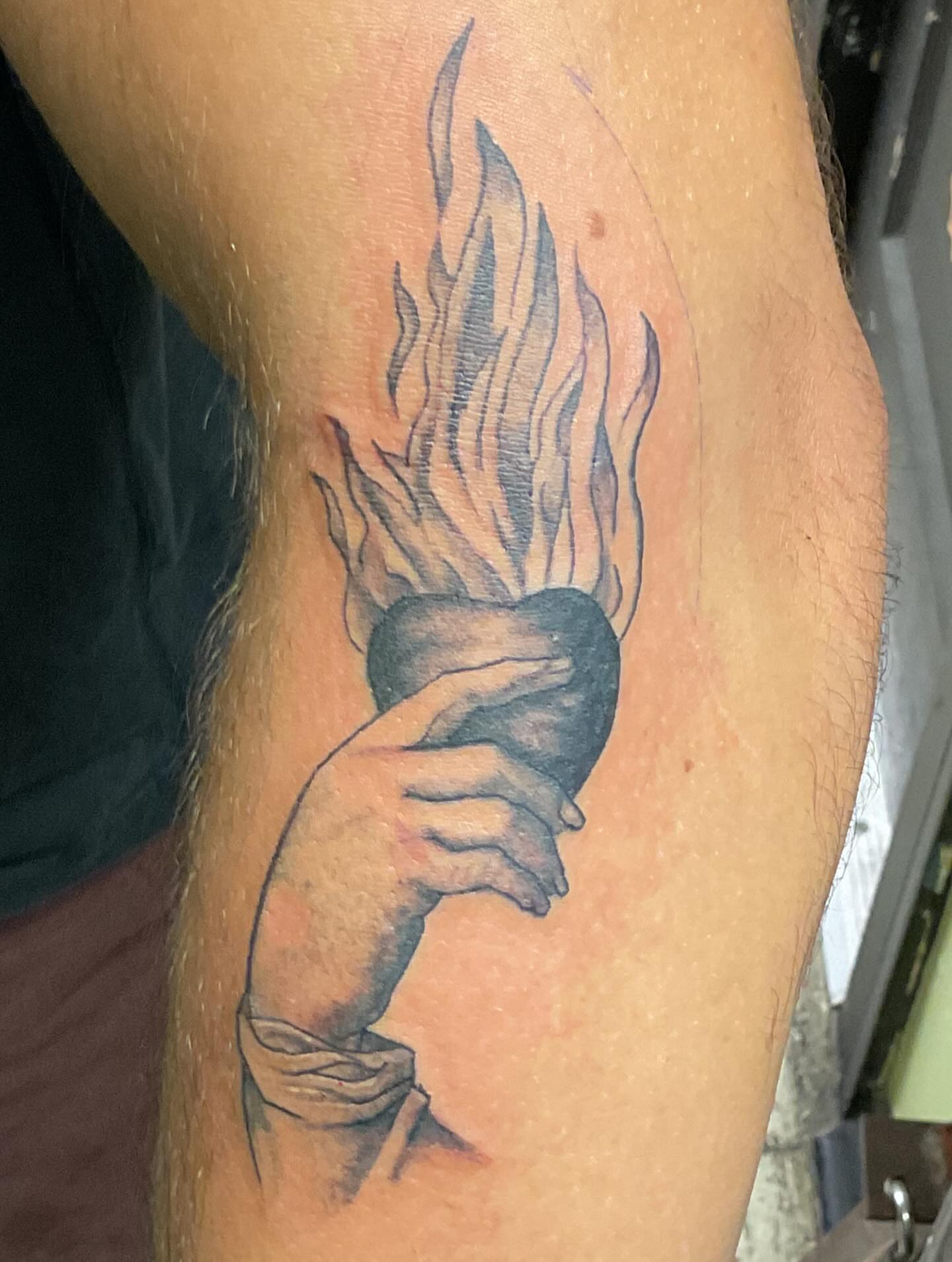 Flame black and grey tattoo on the forearm by Roachrude
