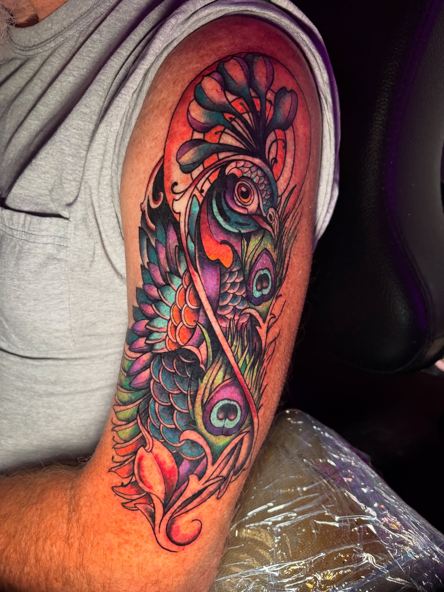 Peacock new school tattoo on the forearm by Jessica Roberts