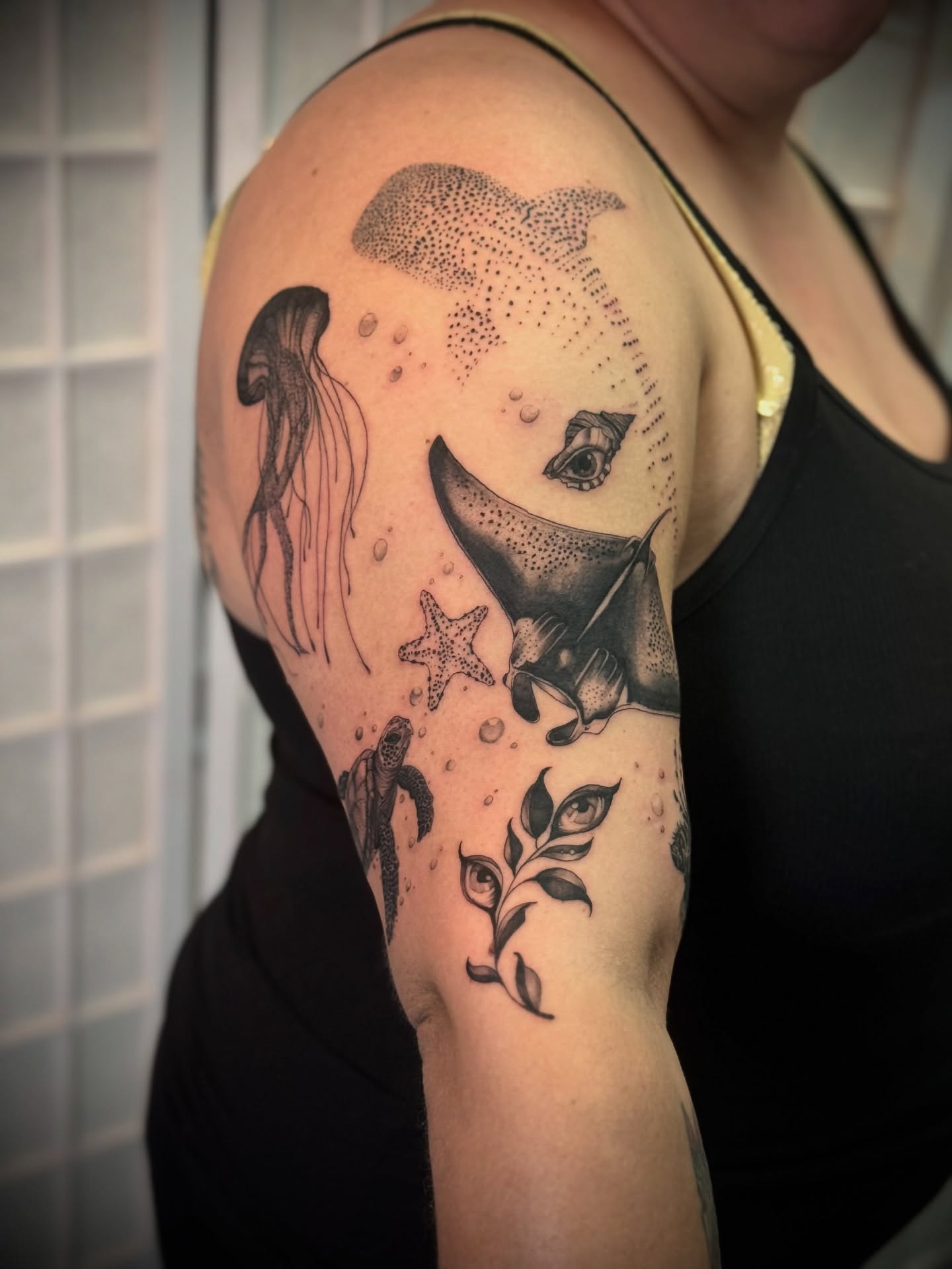 Underwater scene dotwork tattoo on the upper arm by Kbtattz