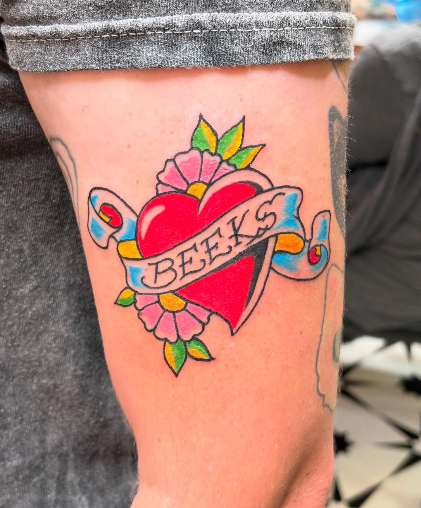 Heart with ribbon American traditional tattoo on the forearm by ☻︎ Cyd Precious ☹︎