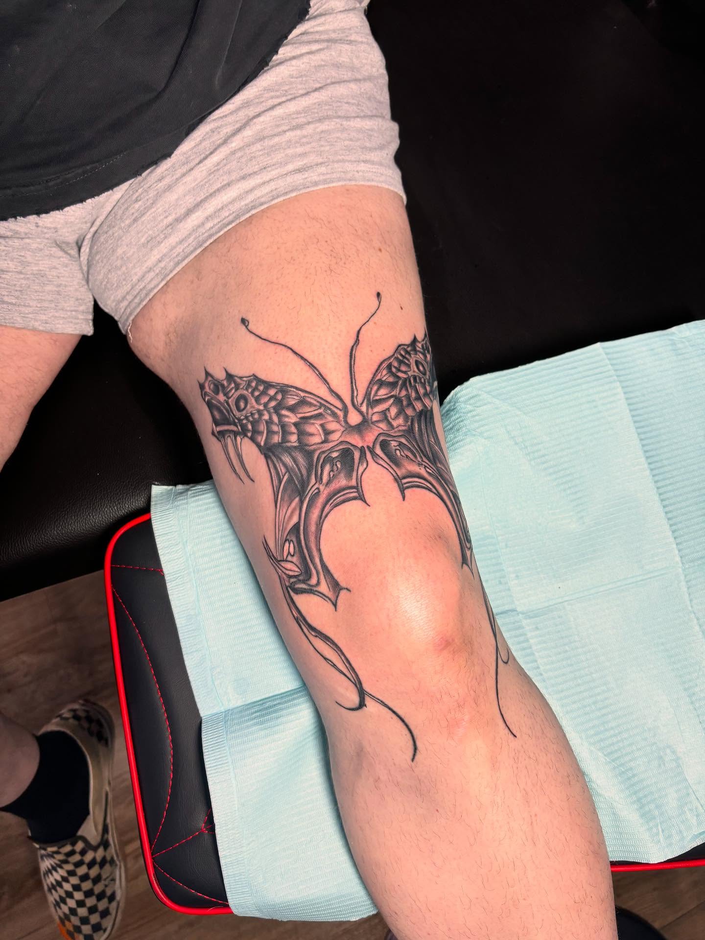 Butterfly geometric tattoo on the forearm by Alyssa Turner