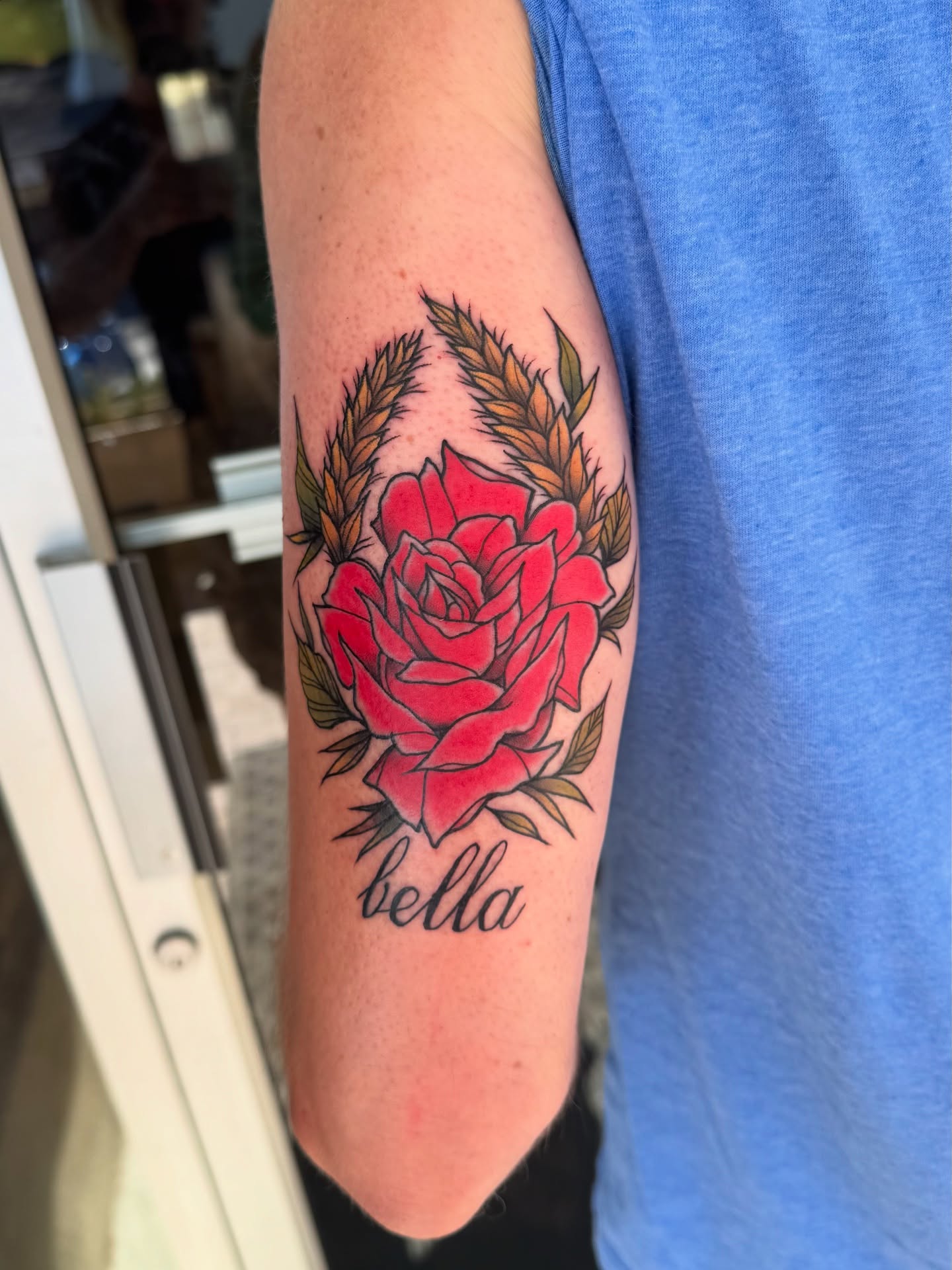 Red rose realism tattoo on the forearm by Michael Langdale