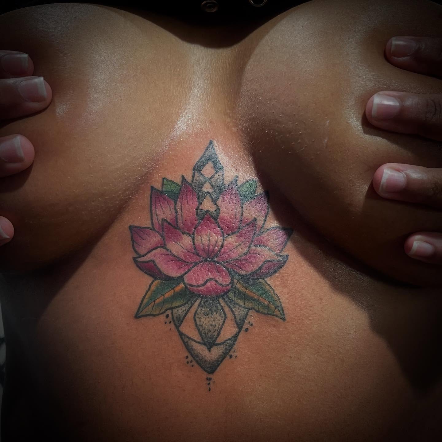 Lotus flower dotwork tattoo on the chest by Don Juan