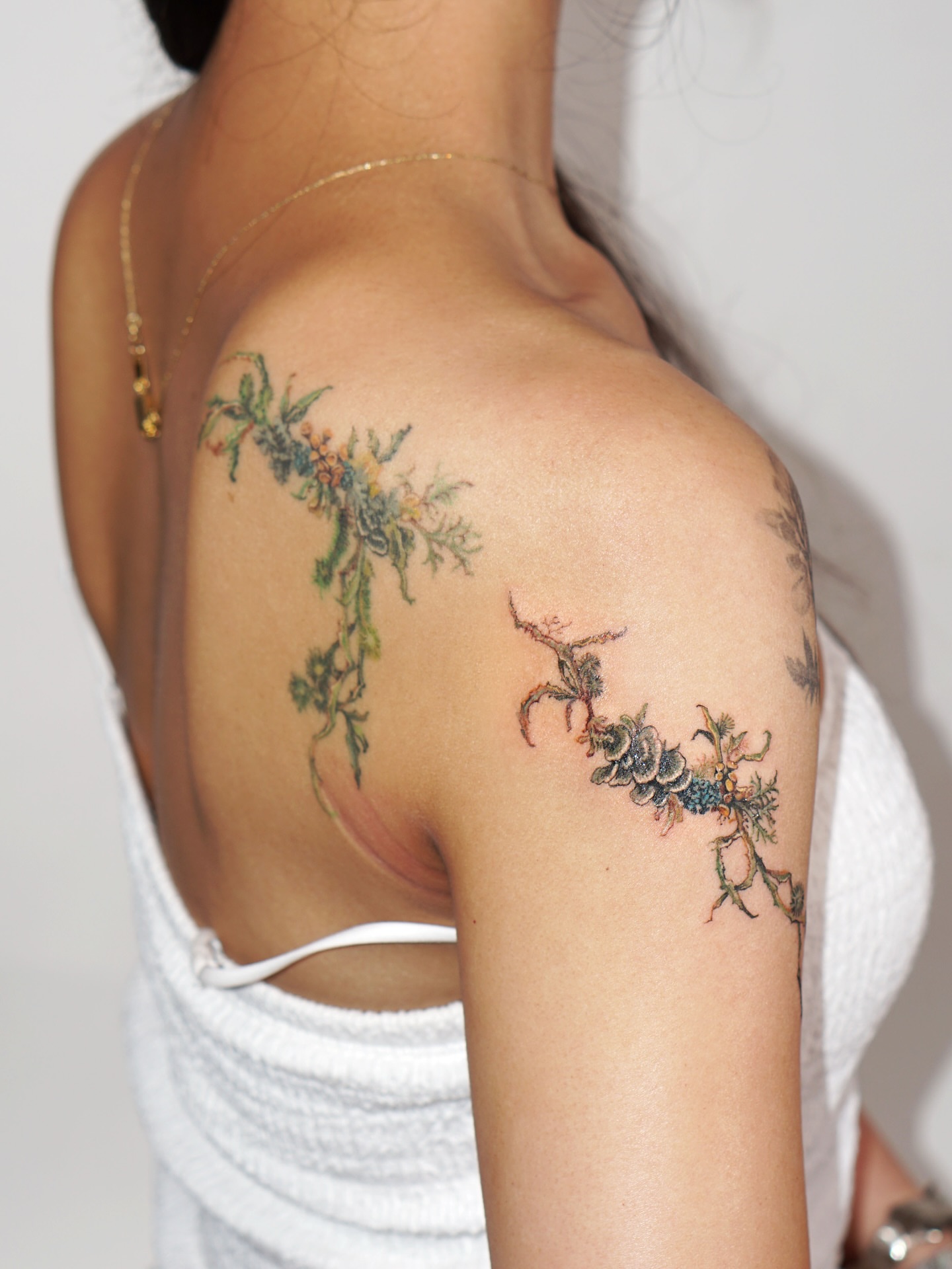 Floral vine realism tattoo on the shoulder by Isle