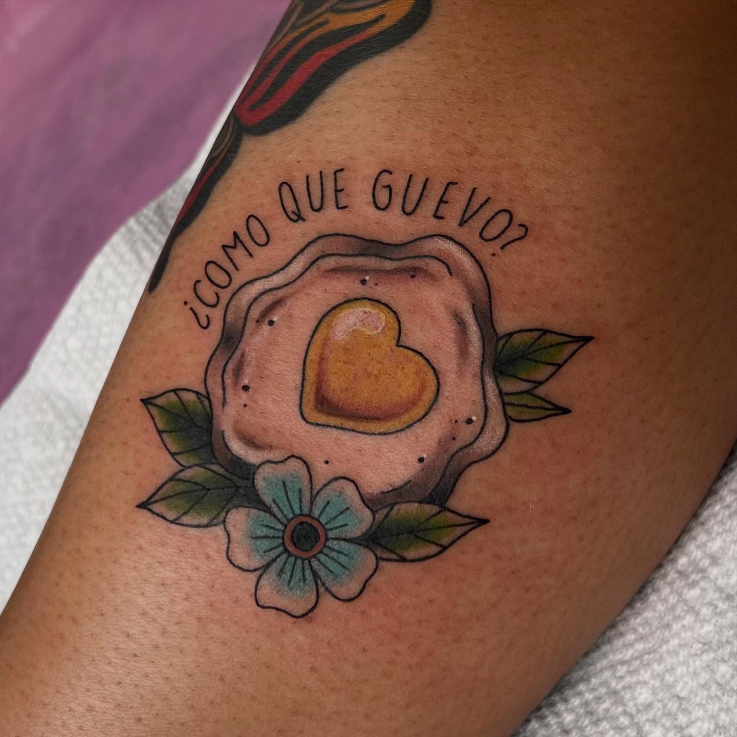 Heart-shaped fried egg American traditional tattoo on the forearm by Kahlan ⍟
