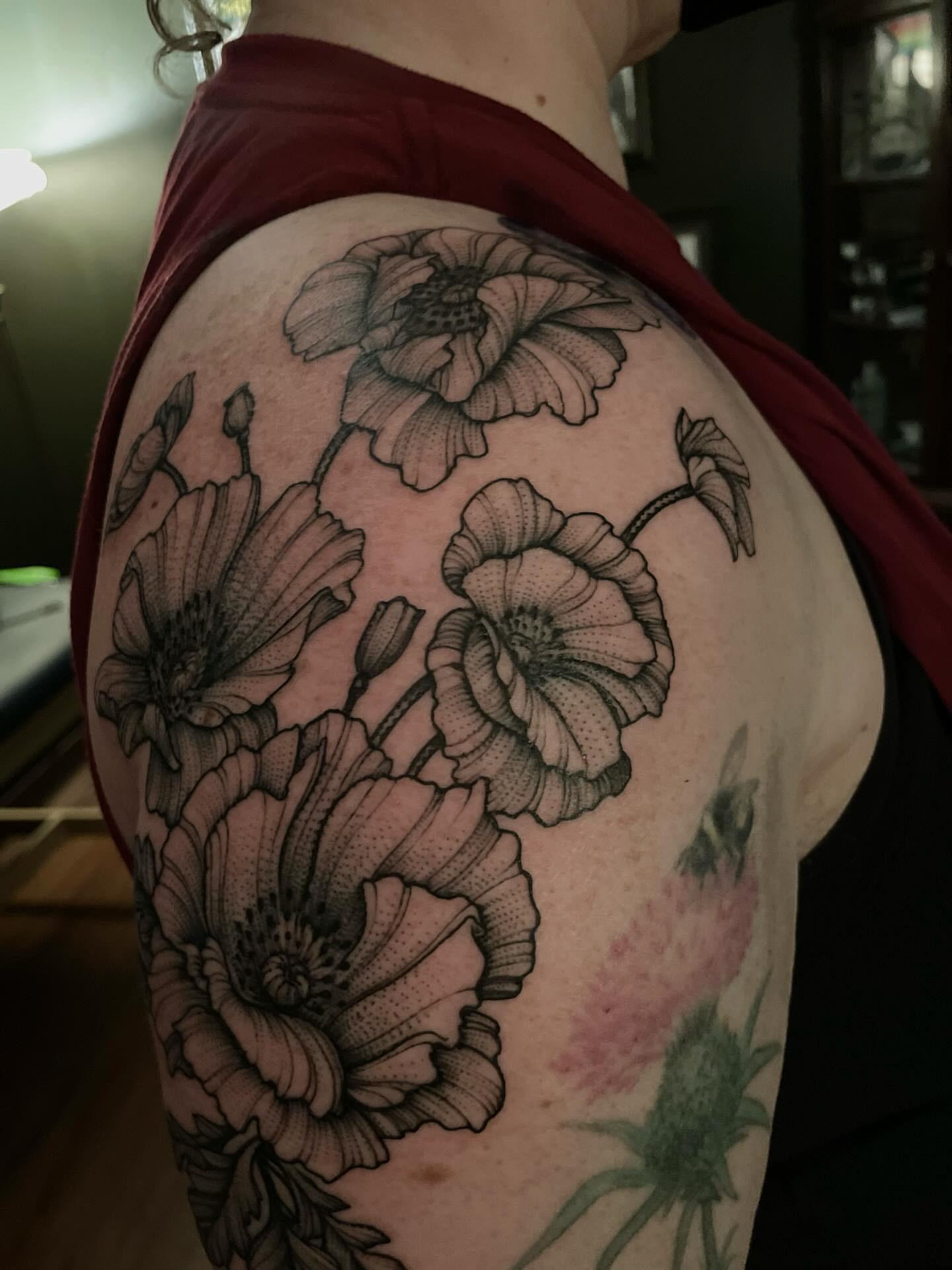 Poppy flowers black and grey tattoo on the shoulder by Jacob Kearney