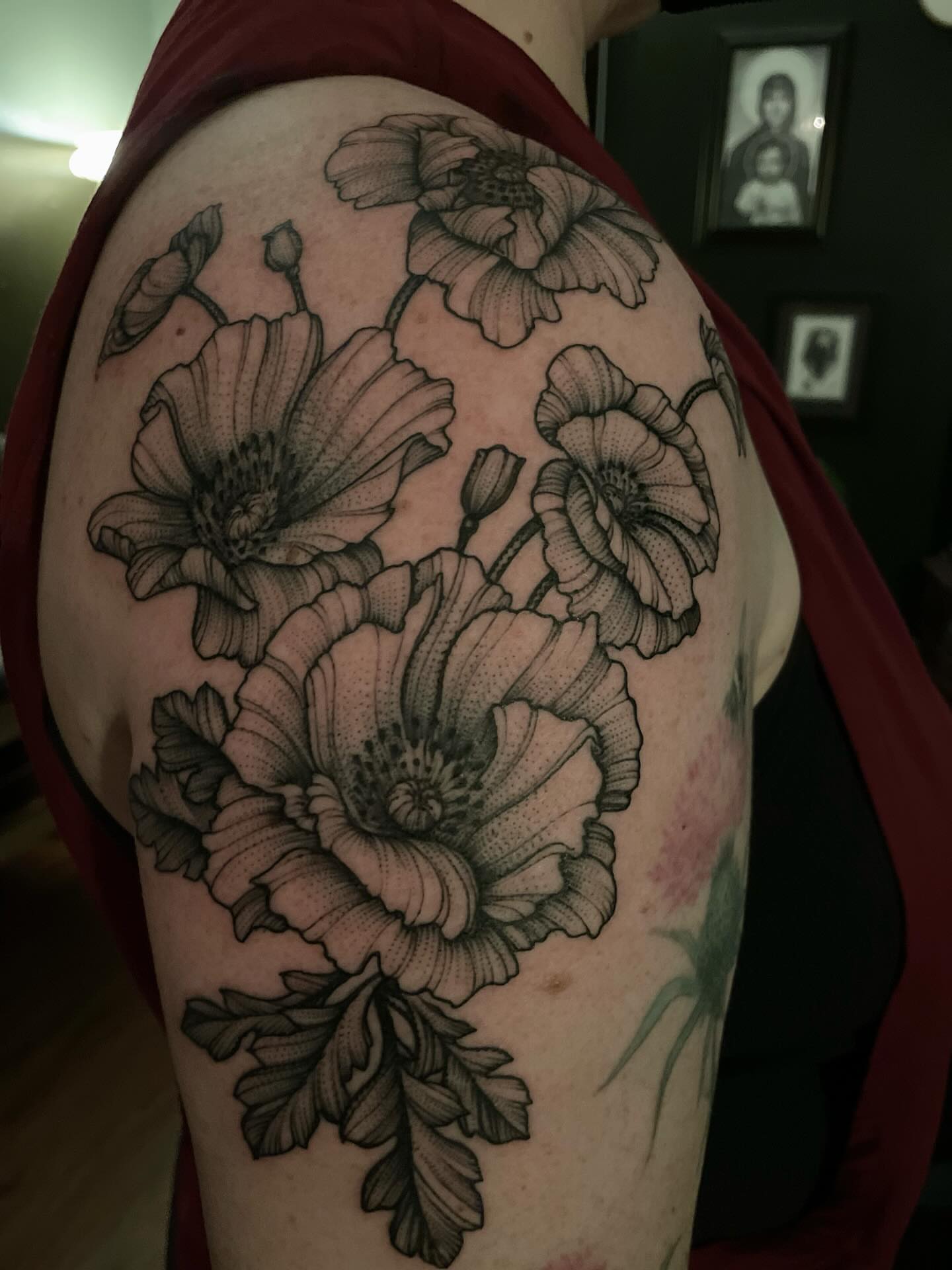 Flowers dotwork tattoo on the shoulder by Jacob Kearney