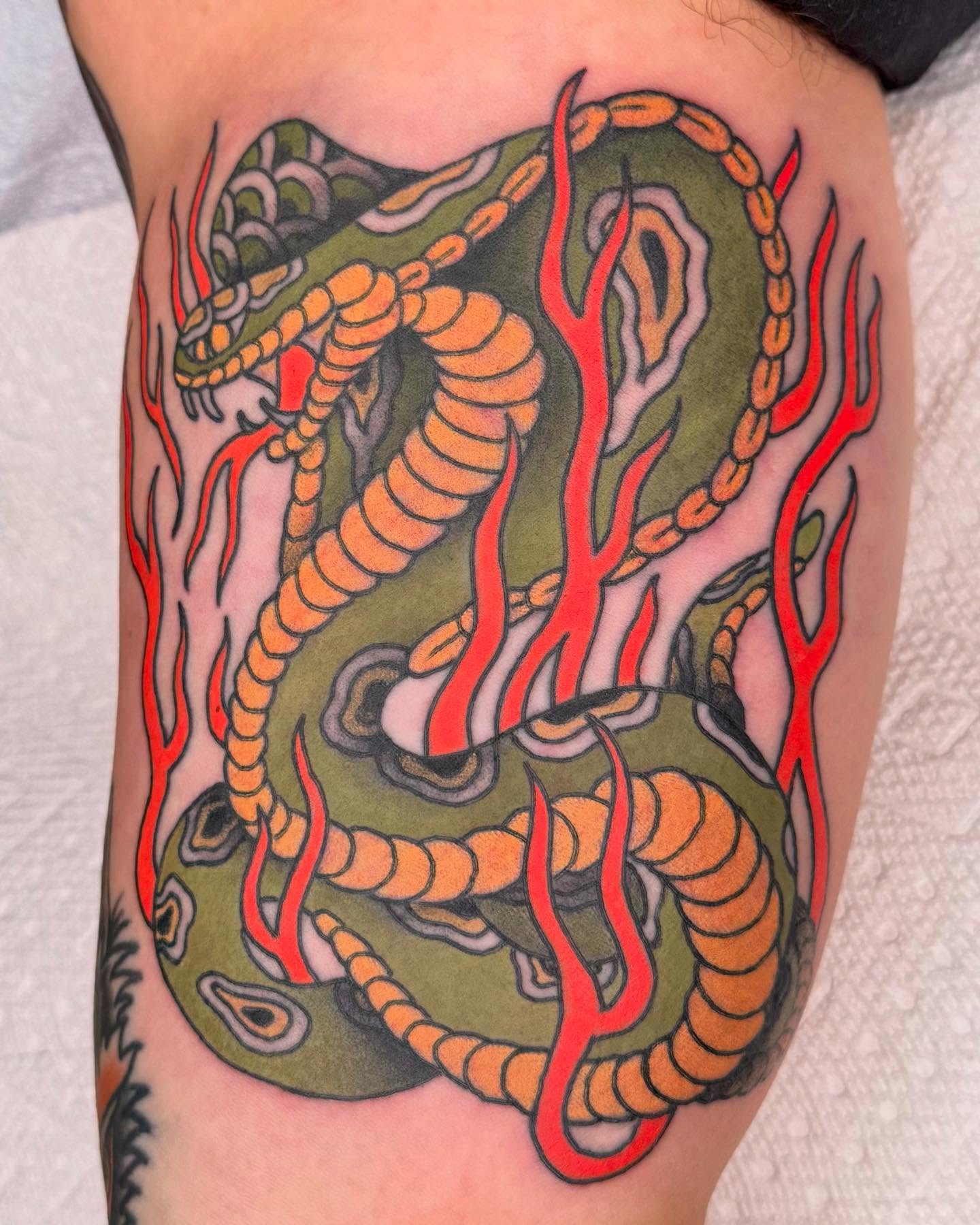 Snake American traditional tattoo on the thigh by Curtis Stairs, Seattle, Washington