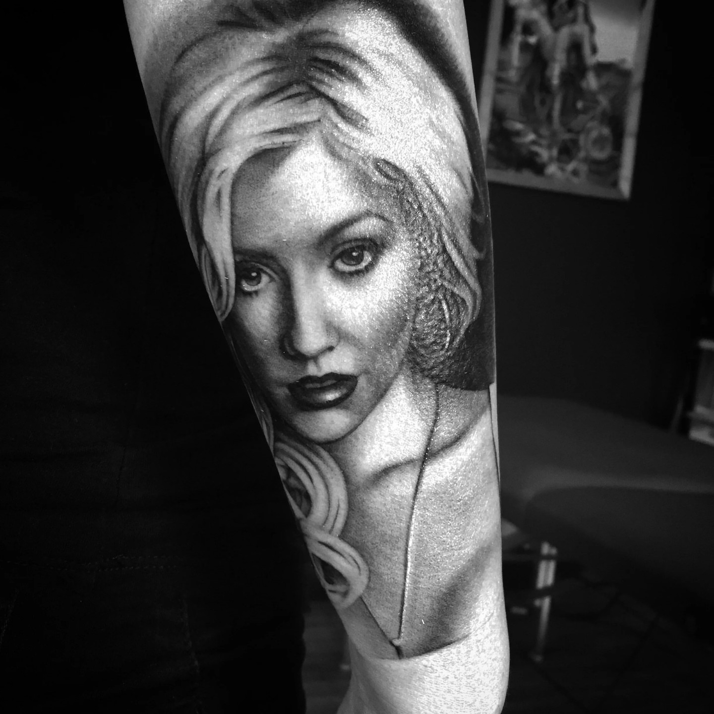 Portrait realism tattoo on the forearm by F e A R