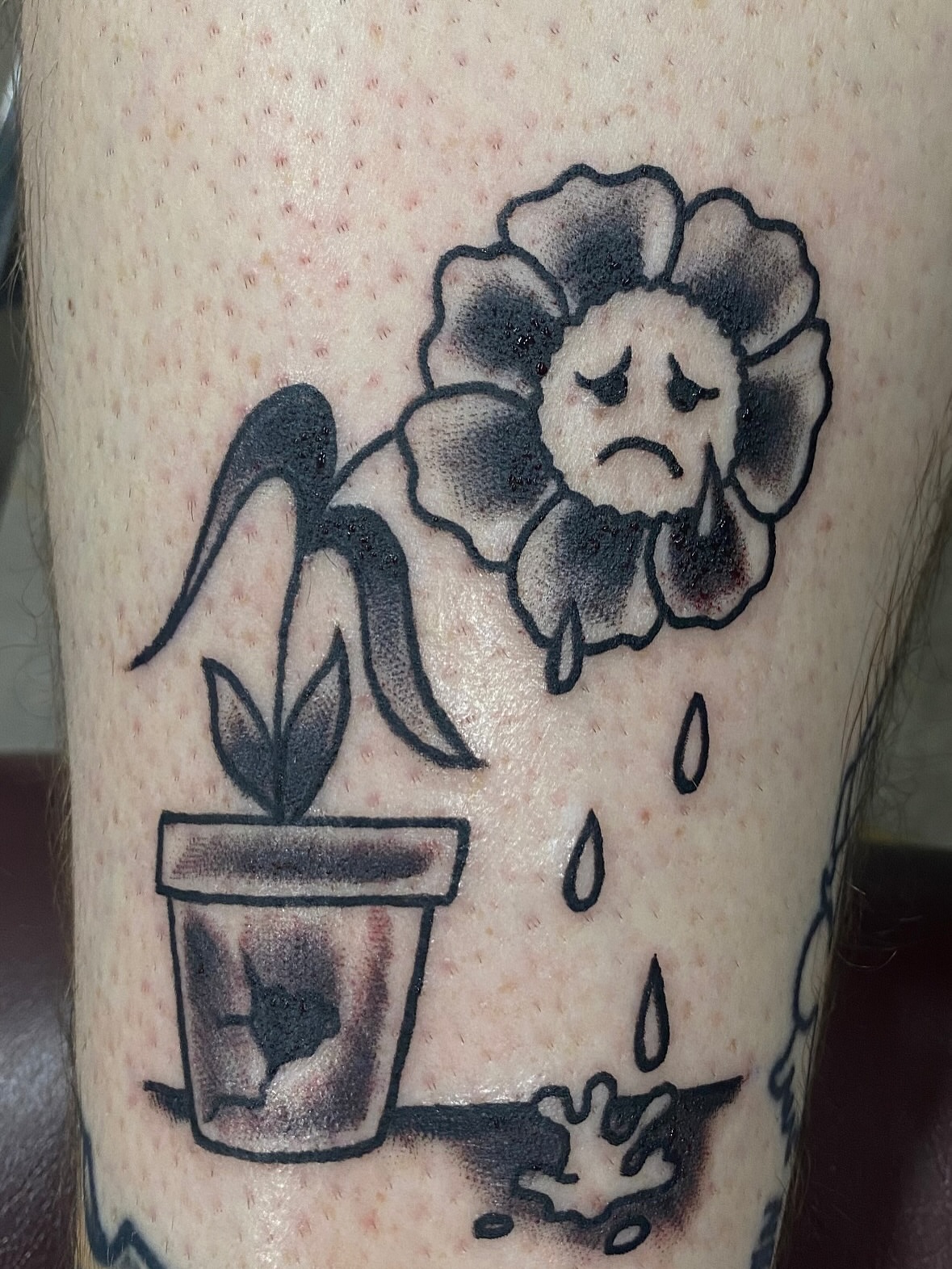Sad flower black and grey tattoo on the forearm by John Black