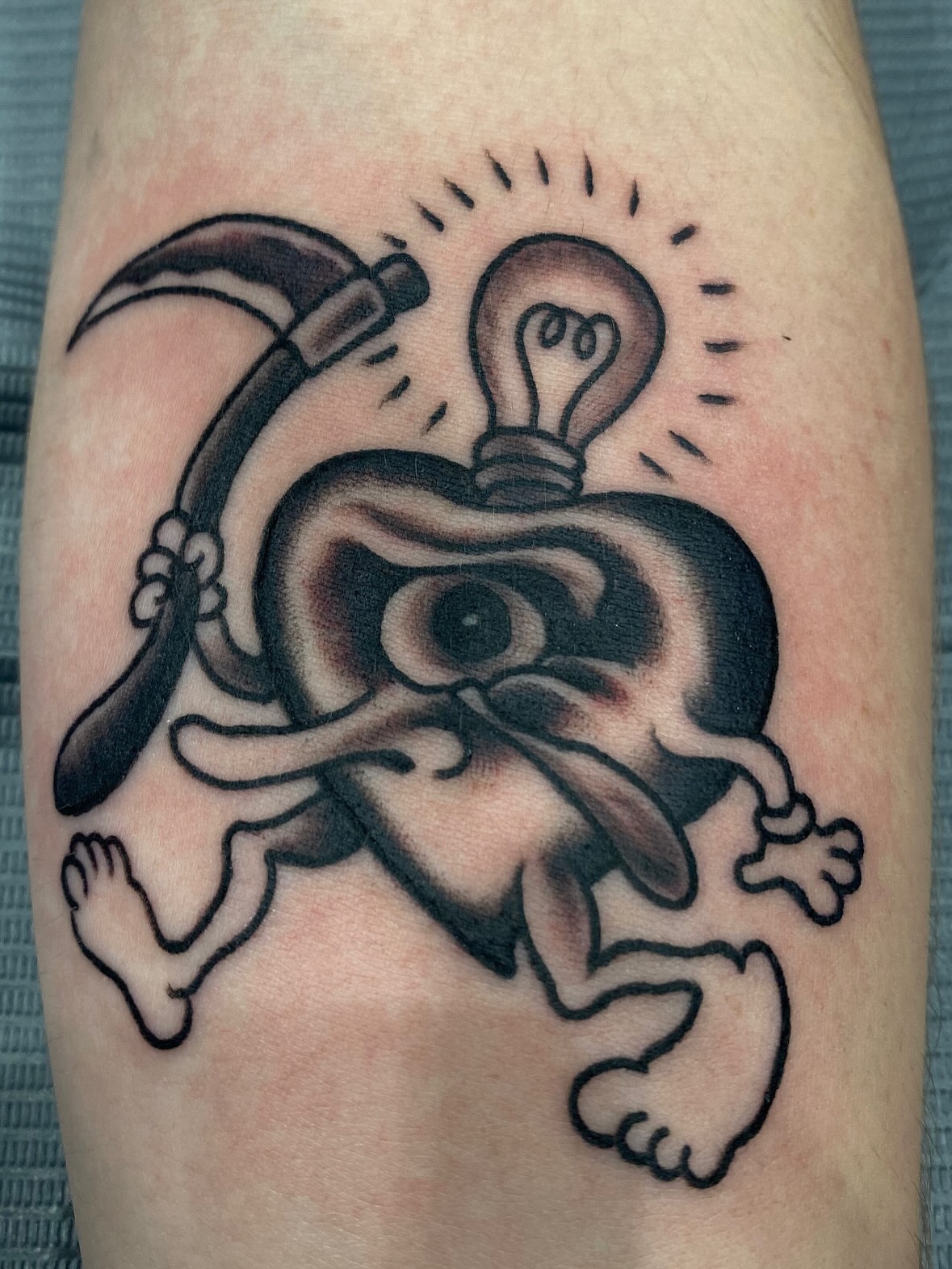 Monkey with hammer and light bulb American traditional tattoo on the forearm by John Black
