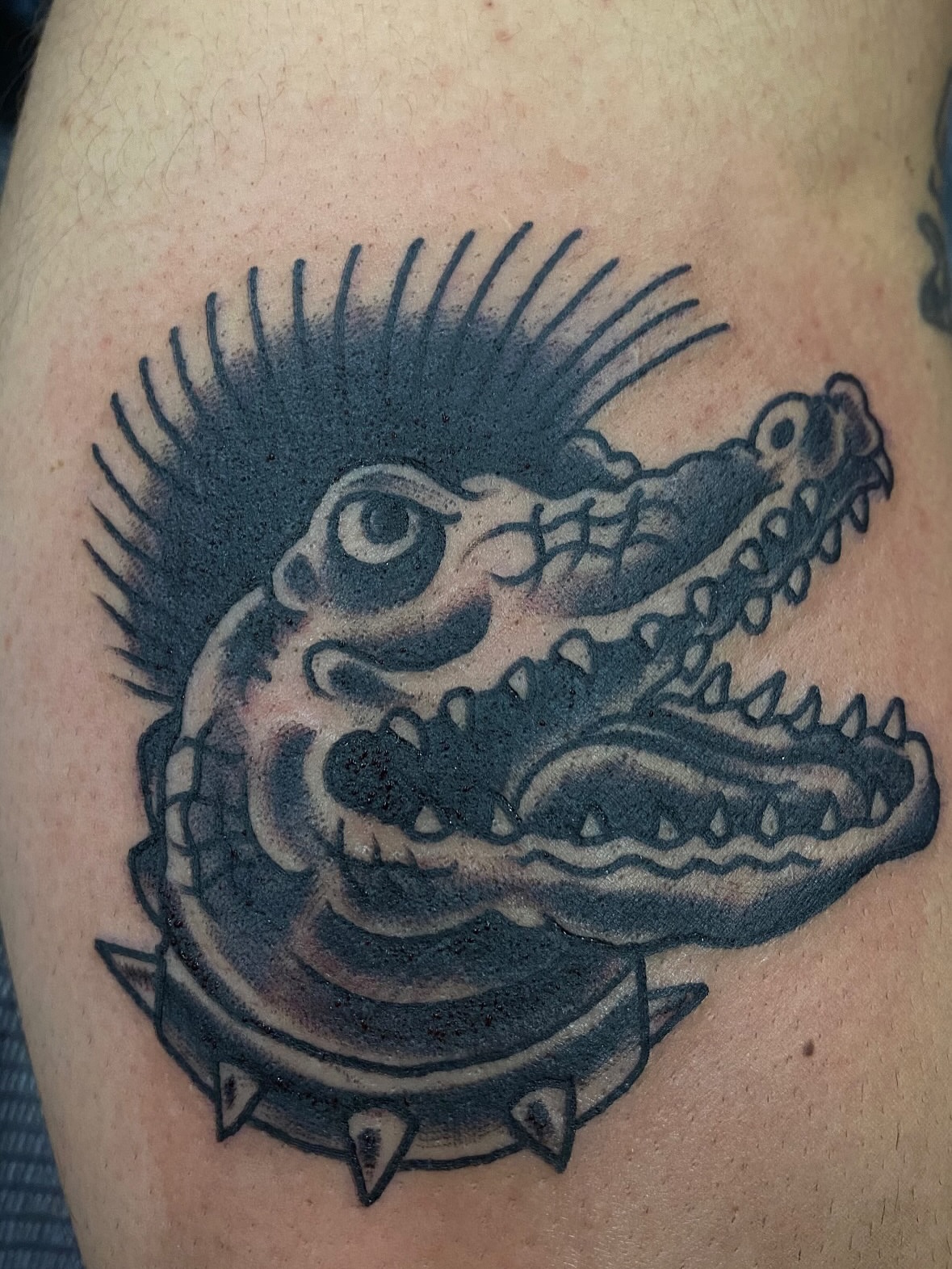 Alligator black and grey tattoo on the thigh by John Black