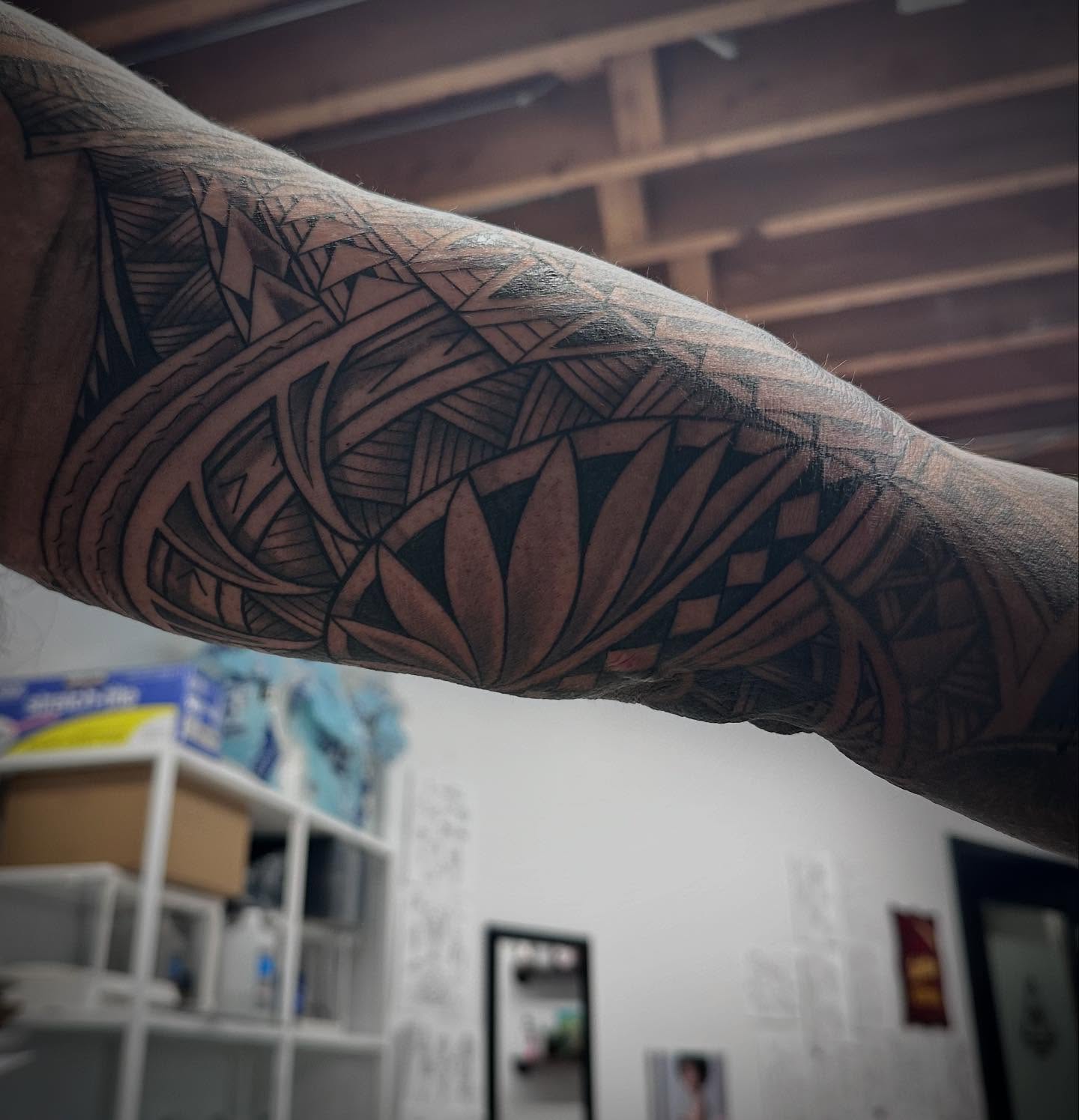 Geometric pattern geometric tattoo on the forearm by Teddi Bird