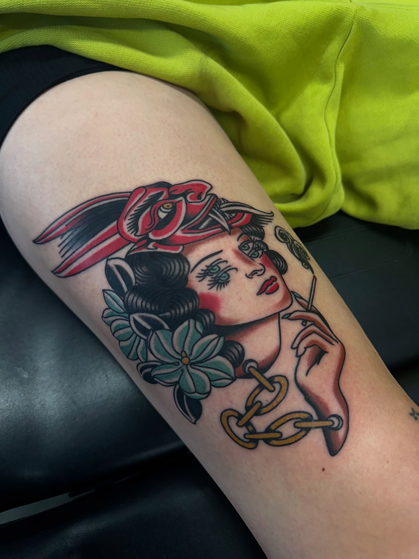 Woman with rabbit ears American traditional tattoo on the thigh by Christofer Irvin