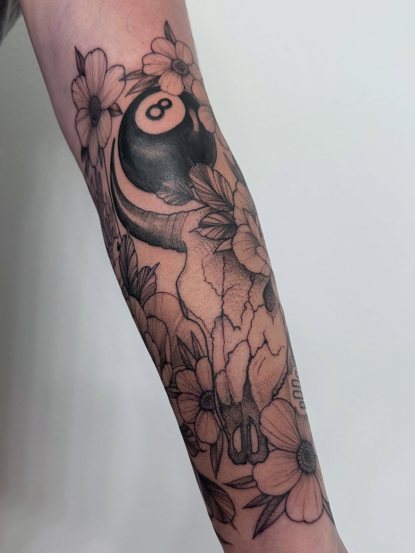 Billiard ball and floral black and grey tattoo on the forearm by ๐ฌ๐๐๐ฏ๐ ๐ฆ ๐๐ฉ๐ฆ๐ท๐๐๐ข๐ฑ๐ฅ ๐ซง๐ผ, Joplin, Missouri