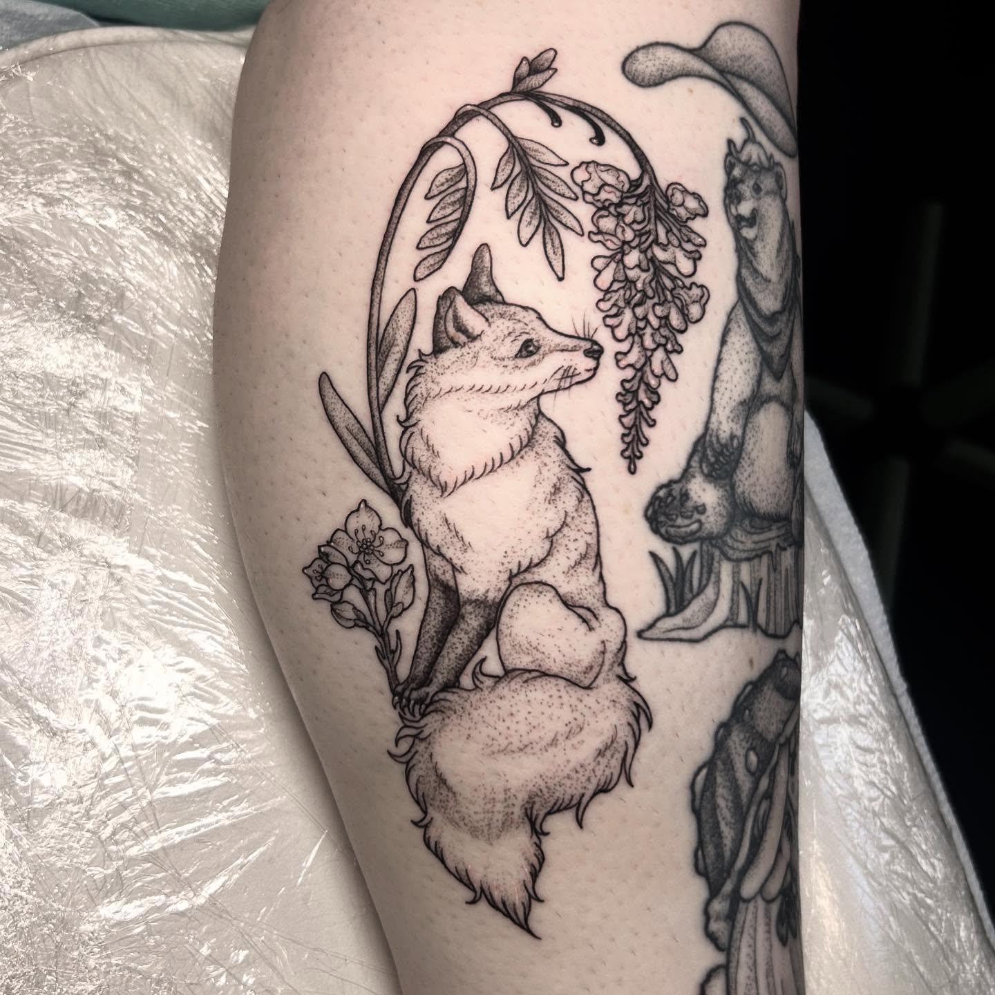 Fox and flowers dotwork tattoo on the thigh by Nikki Power