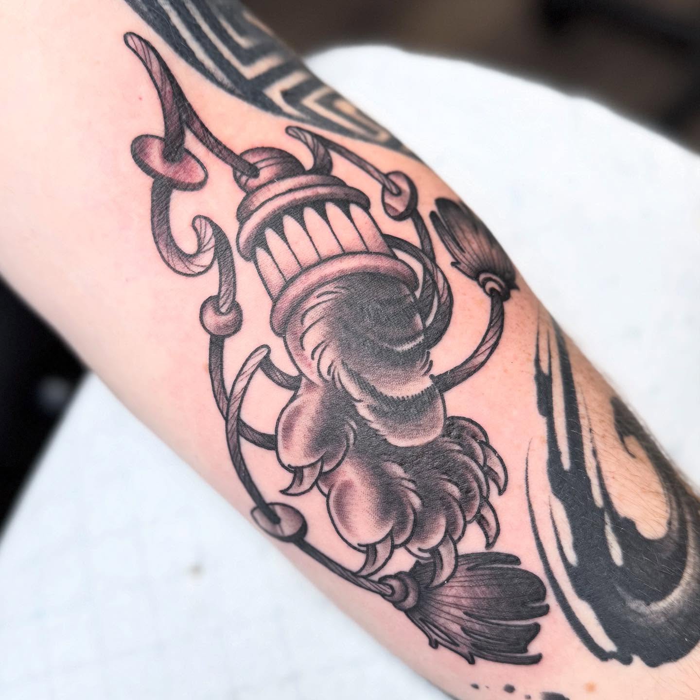 Koi fish American traditional tattoo on the forearm by Chase Martines