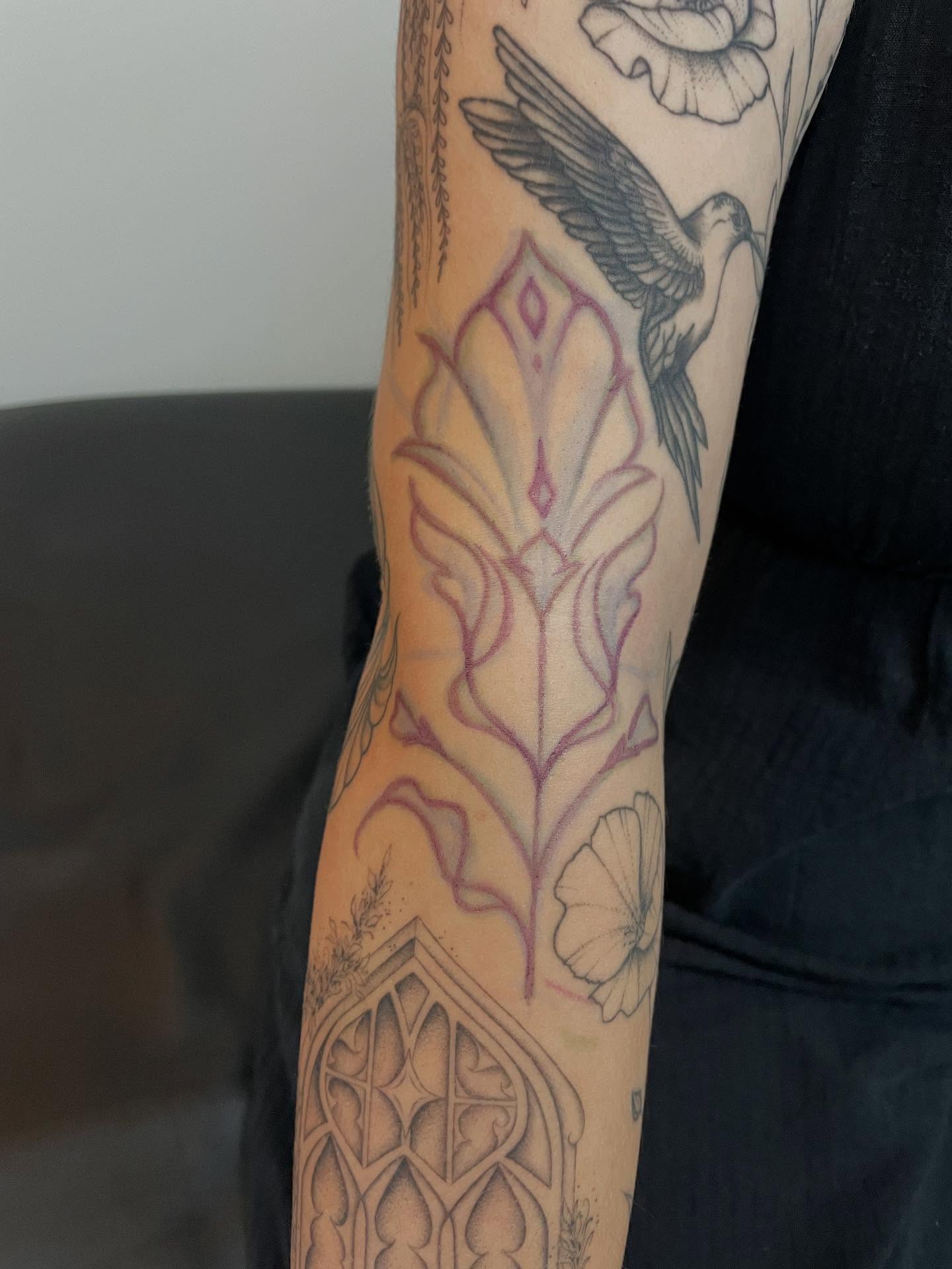 Bird and floral black and grey tattoo on the forearm by Marjeline González🌈🌞