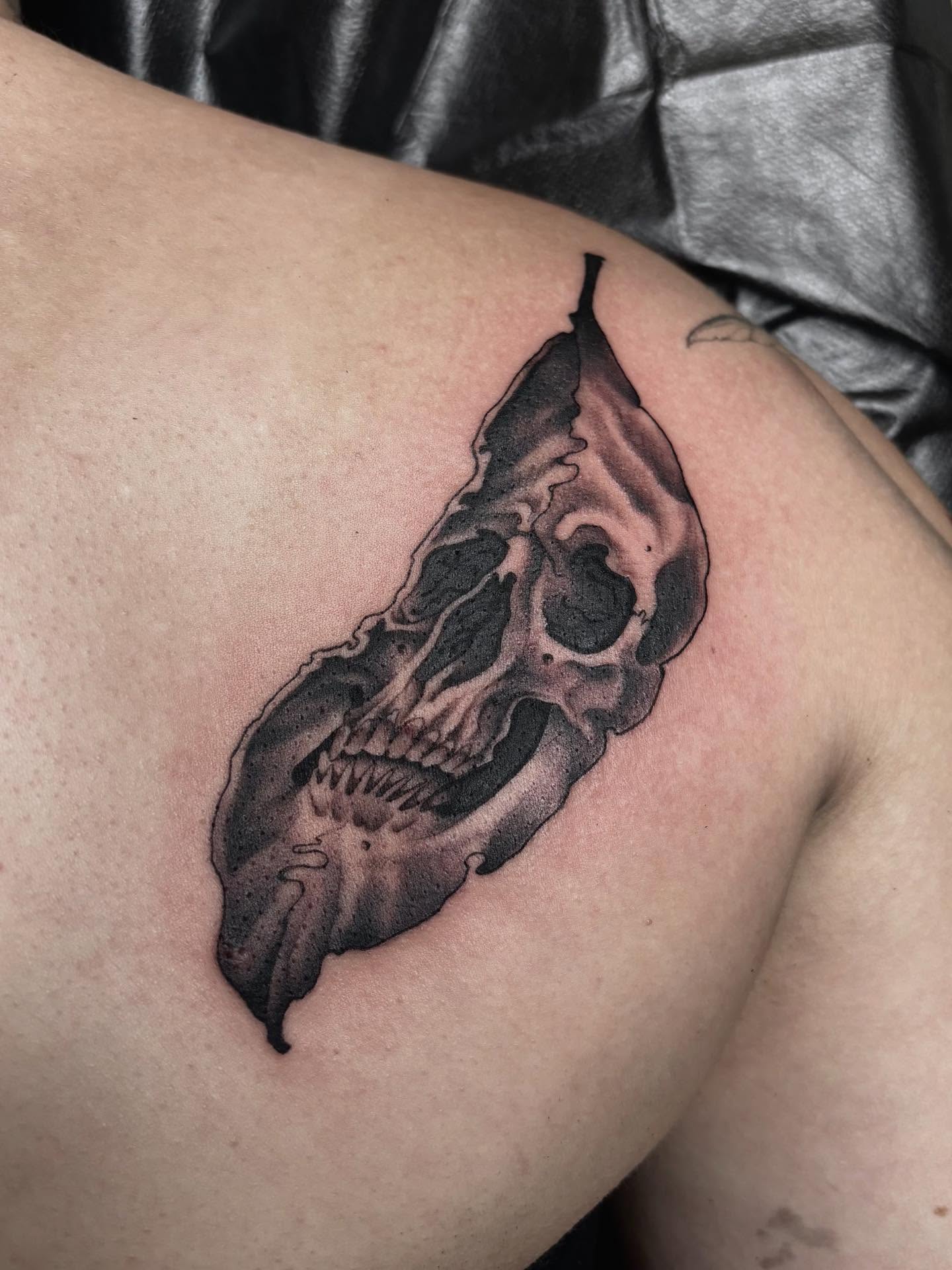 Skull black and grey tattoo on the thigh by Tad Fulkerson, San Francisco, California