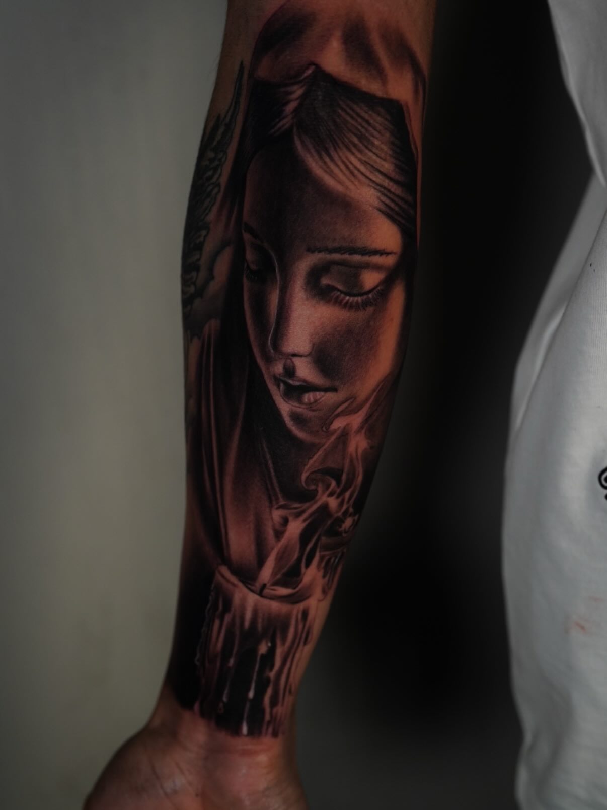 Woman's face realism tattoo on the forearm by Devin