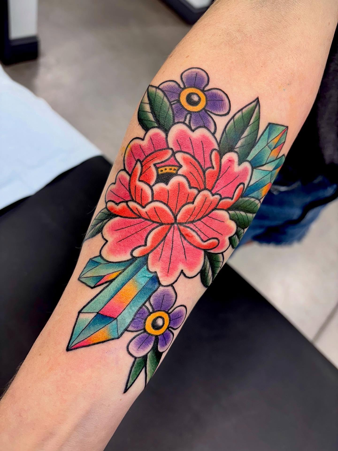 Peony and crystal American traditional tattoo on the forearm by Doug von