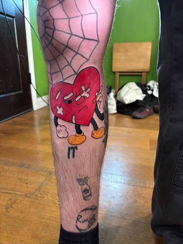 Heart with legs new school tattoo on the calf by zion