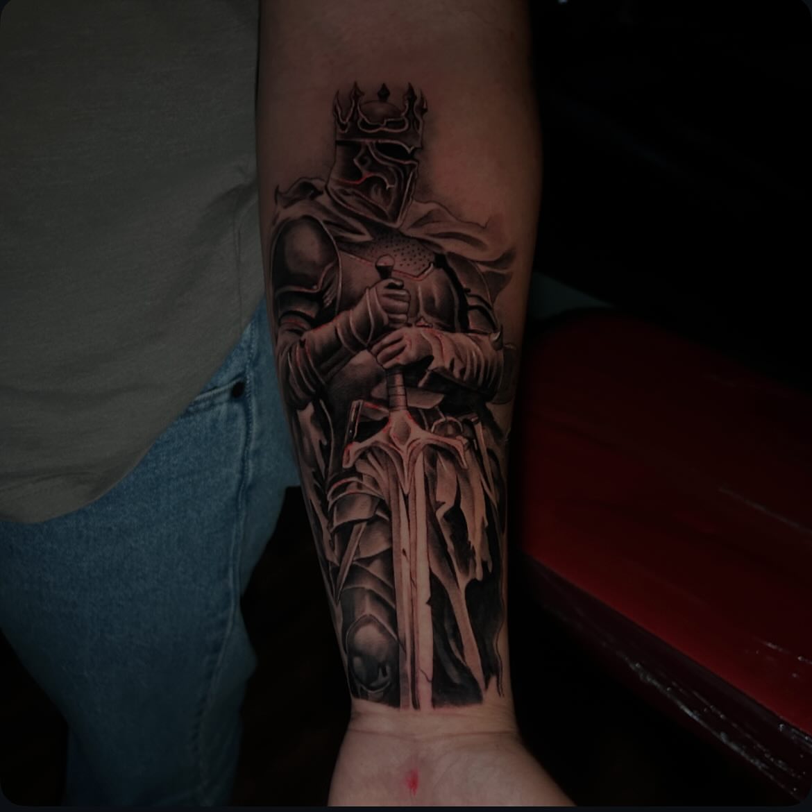 Knight holding sword realism tattoo on the forearm by Alex Cruz 707
