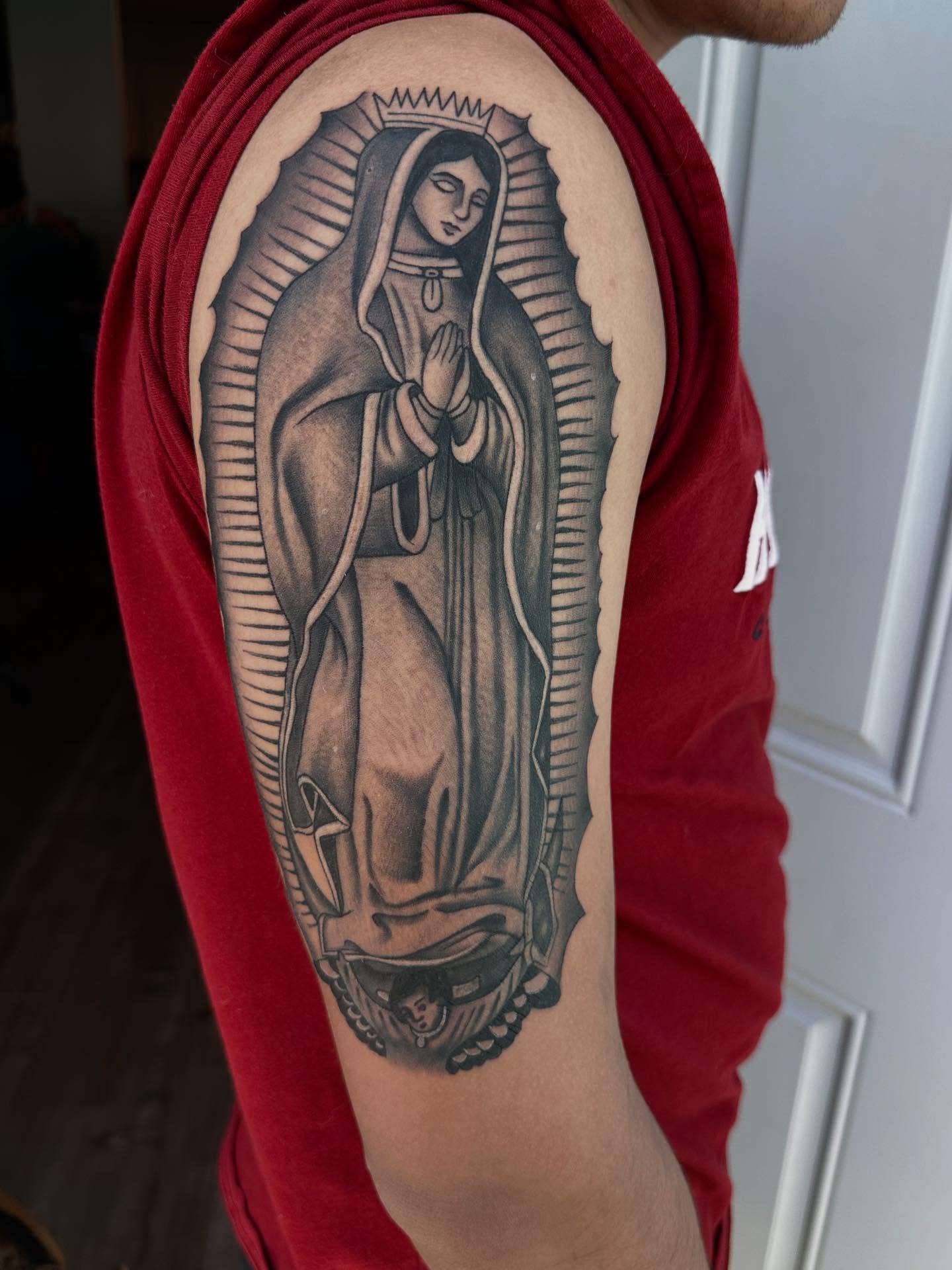 Our Lady of Guadalupe black and grey tattoo on the forearm by Kimberly landin