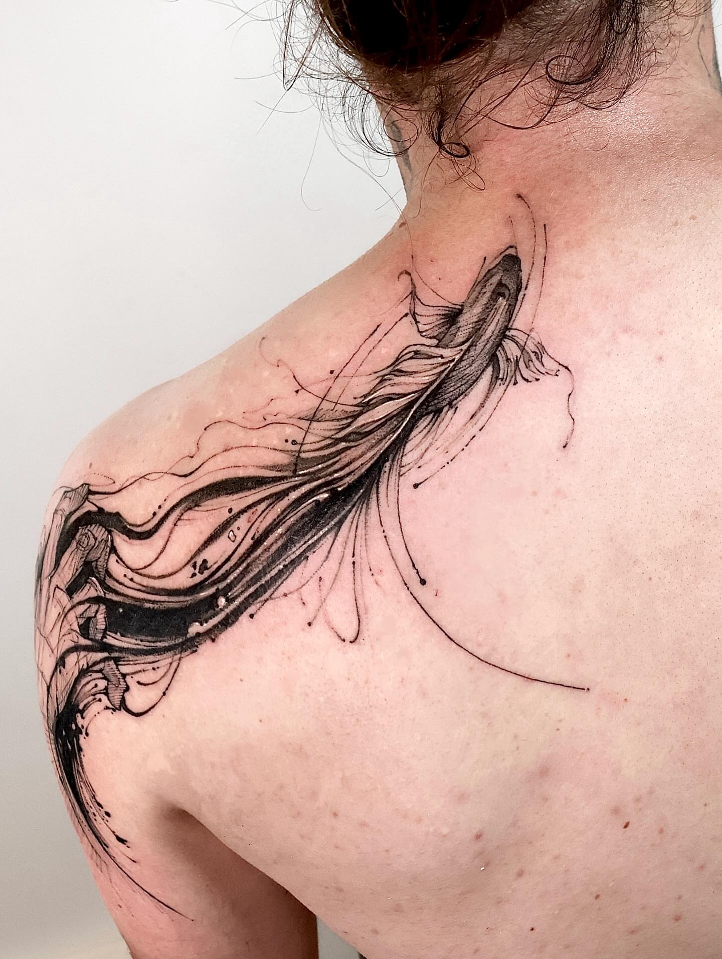 Abstract fish geometric tattoo on the shoulder by Tadi