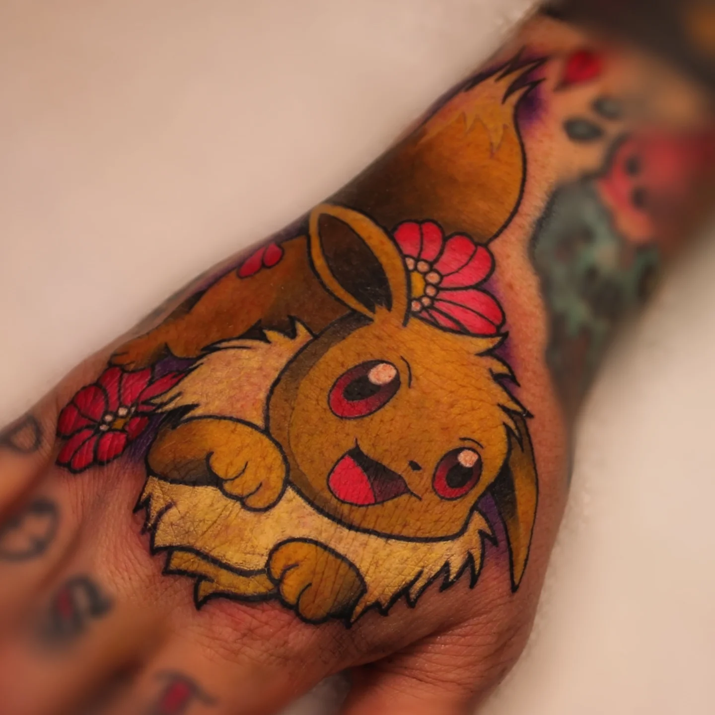 Eevee American traditional tattoo on the forearm by ᴍɪʟᴀ ꜱᴀꜱɪᴇᴛᴀ