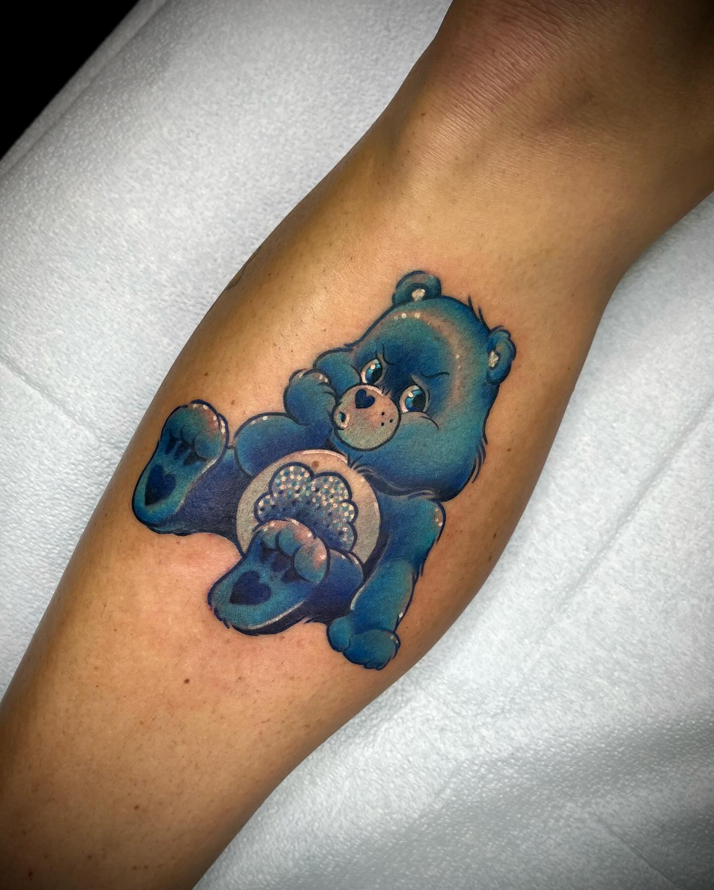 Blue teddy bear realism tattoo on the forearm by Martha Gual π€ East ATX Tattooer