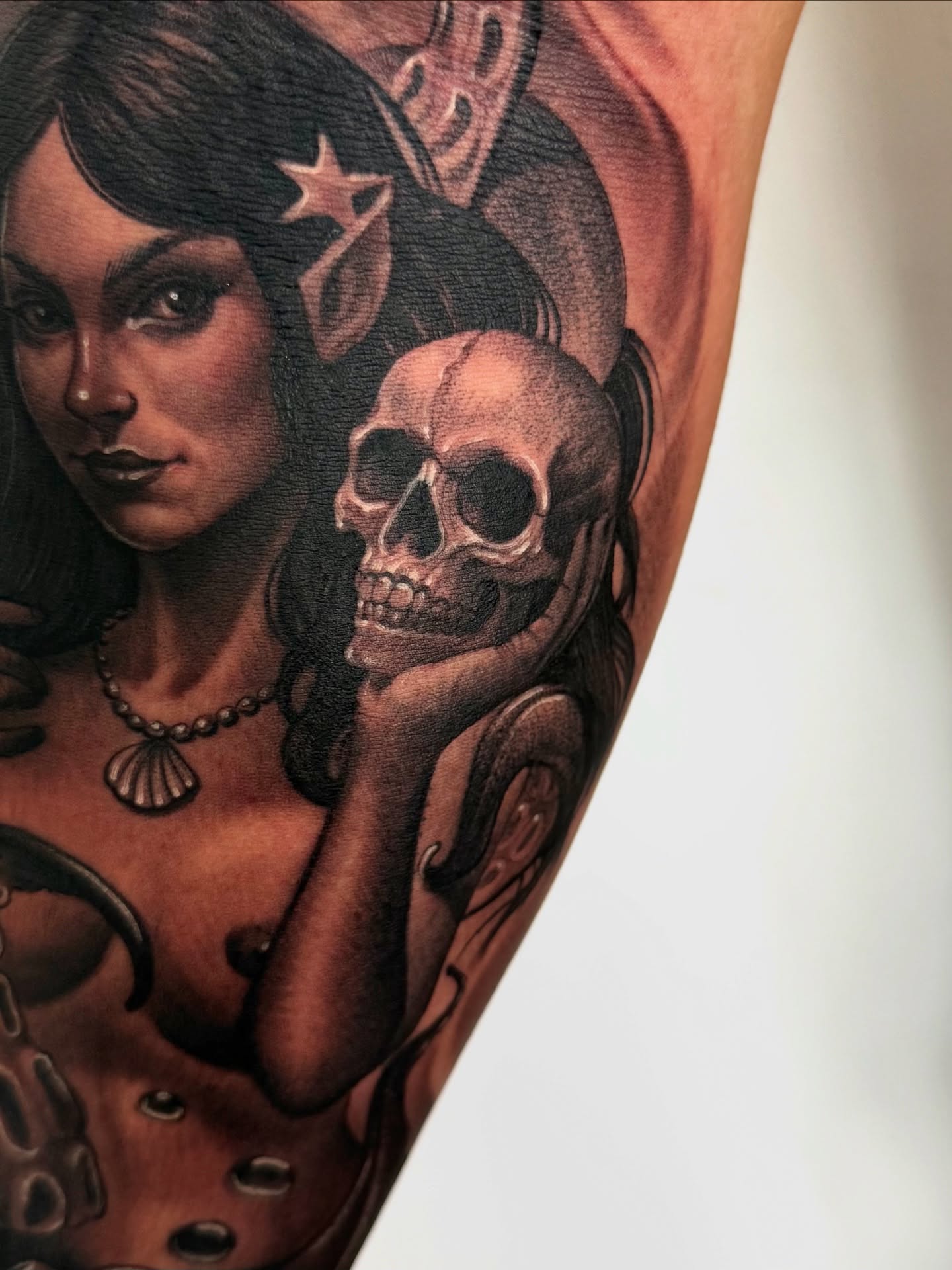 Woman with skull realism tattoo on the forearm by Meza Cruz