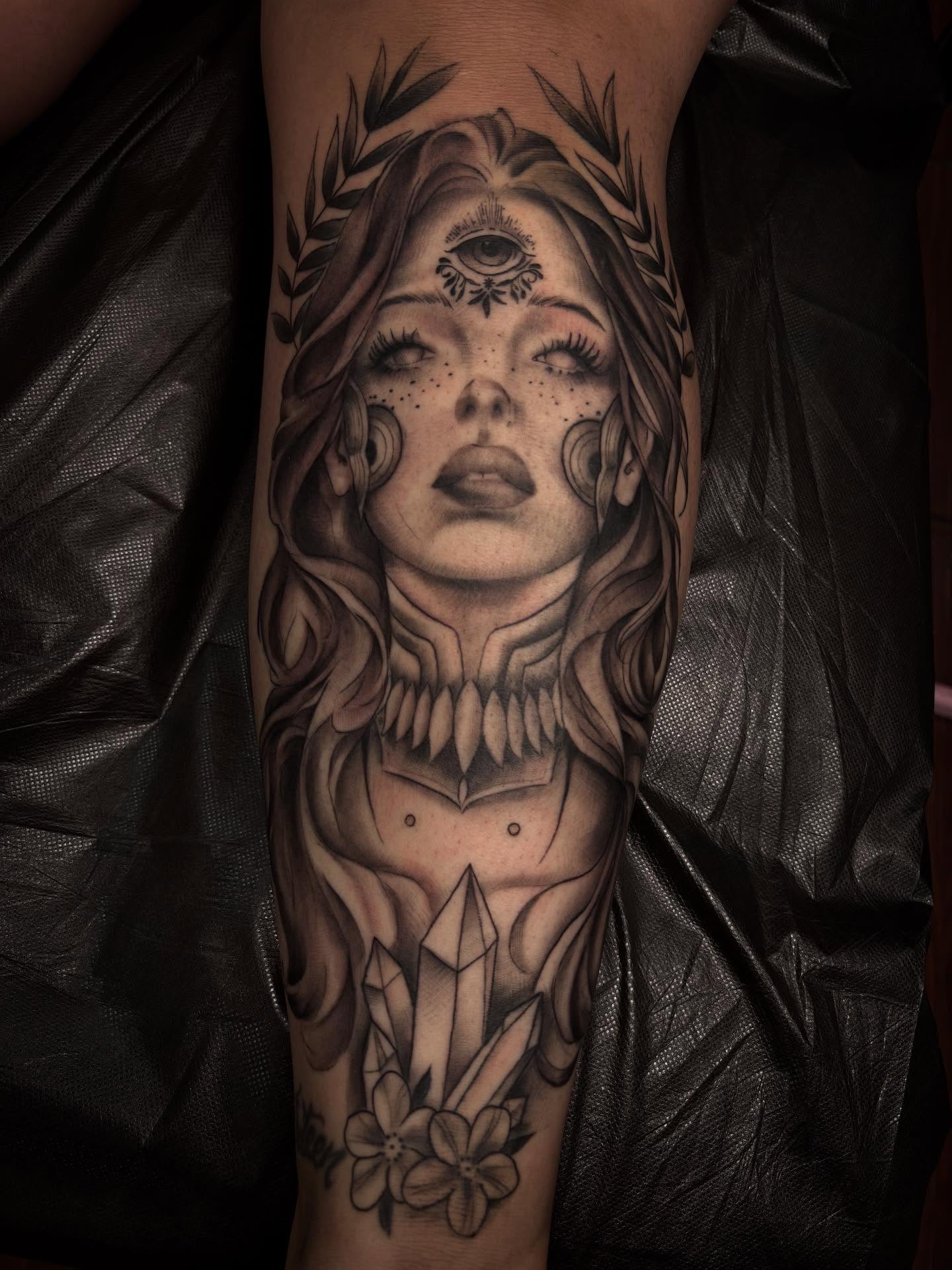 Woman with crystal realism tattoo on the forearm by Alexandria