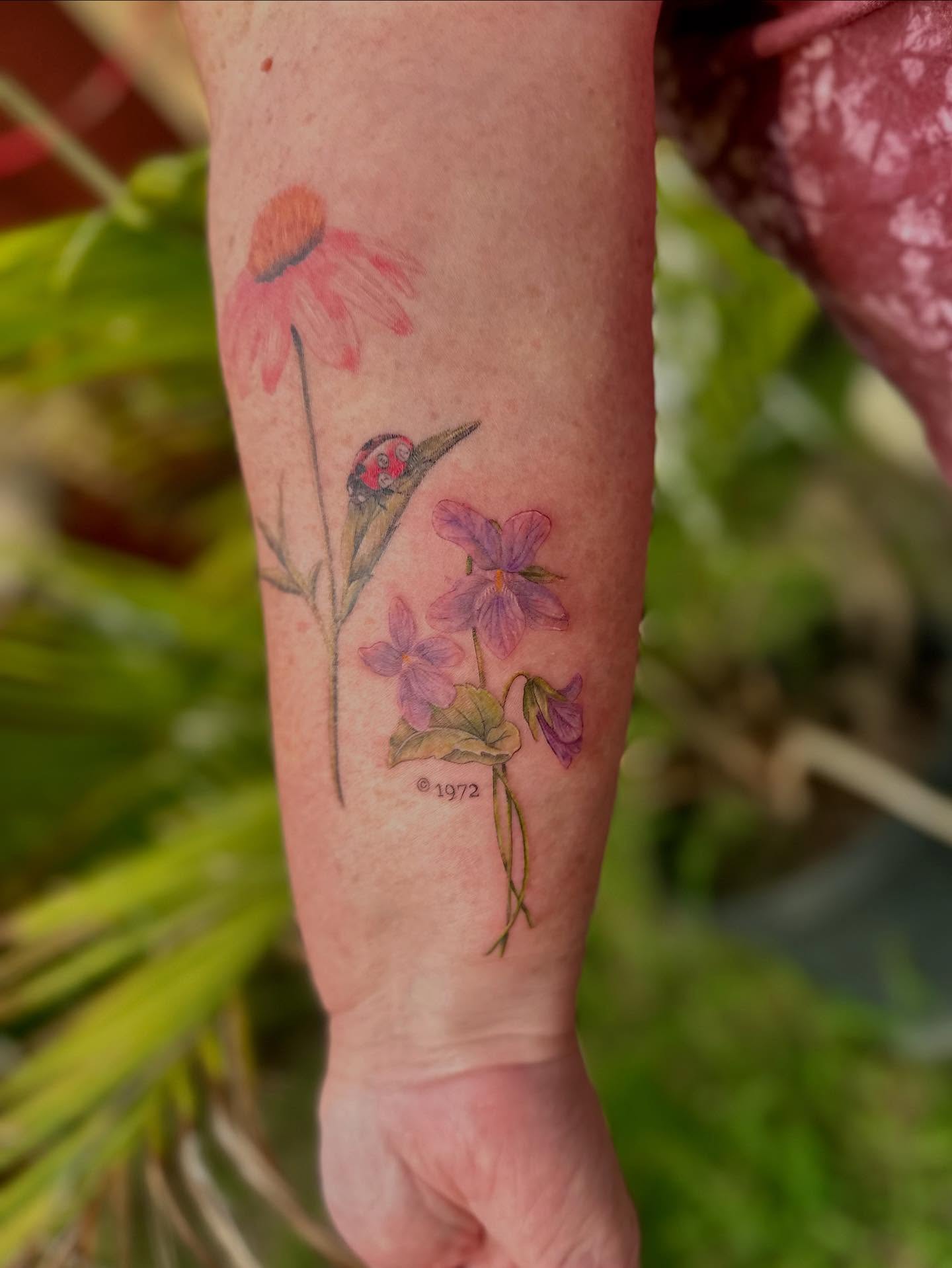 Flowers watercolor tattoo on the forearm by 🌼Kristen Kooster Tattoos🌼