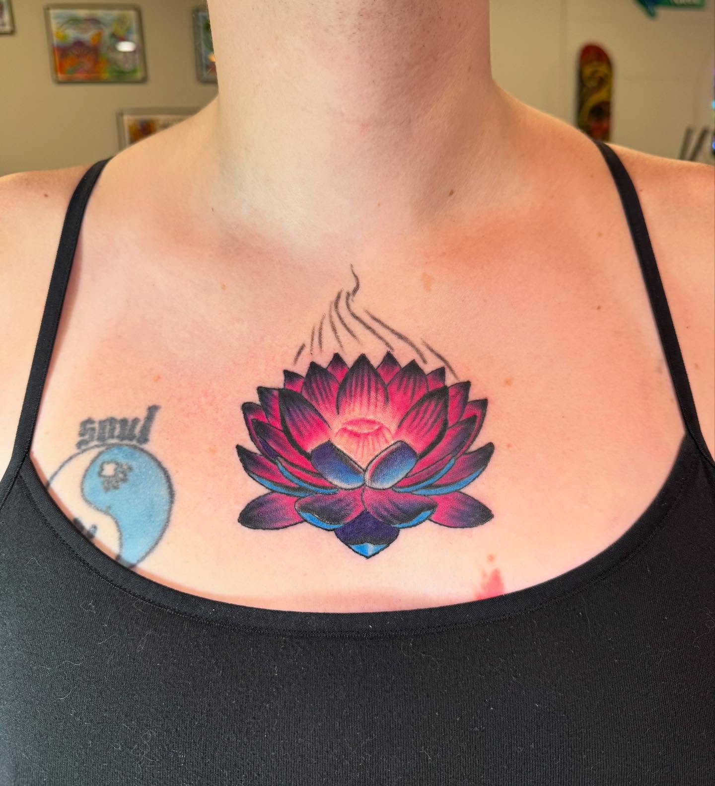 Lotus flower new school tattoo on the chest by spikecitytattoo