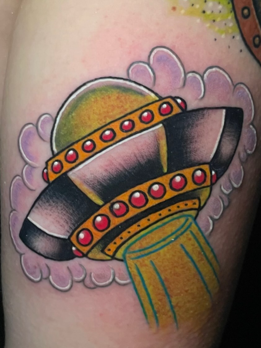 Spacecraft American traditional tattoo on the thigh by Madison ‘Maddog’ Stewart