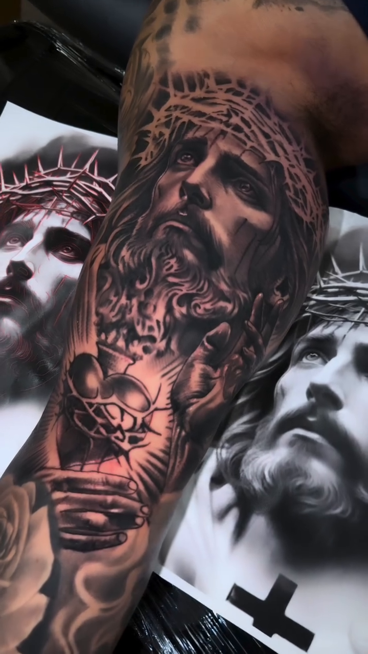 Jesus Christ with crown of thorns realism tattoo by Oscar Baiza