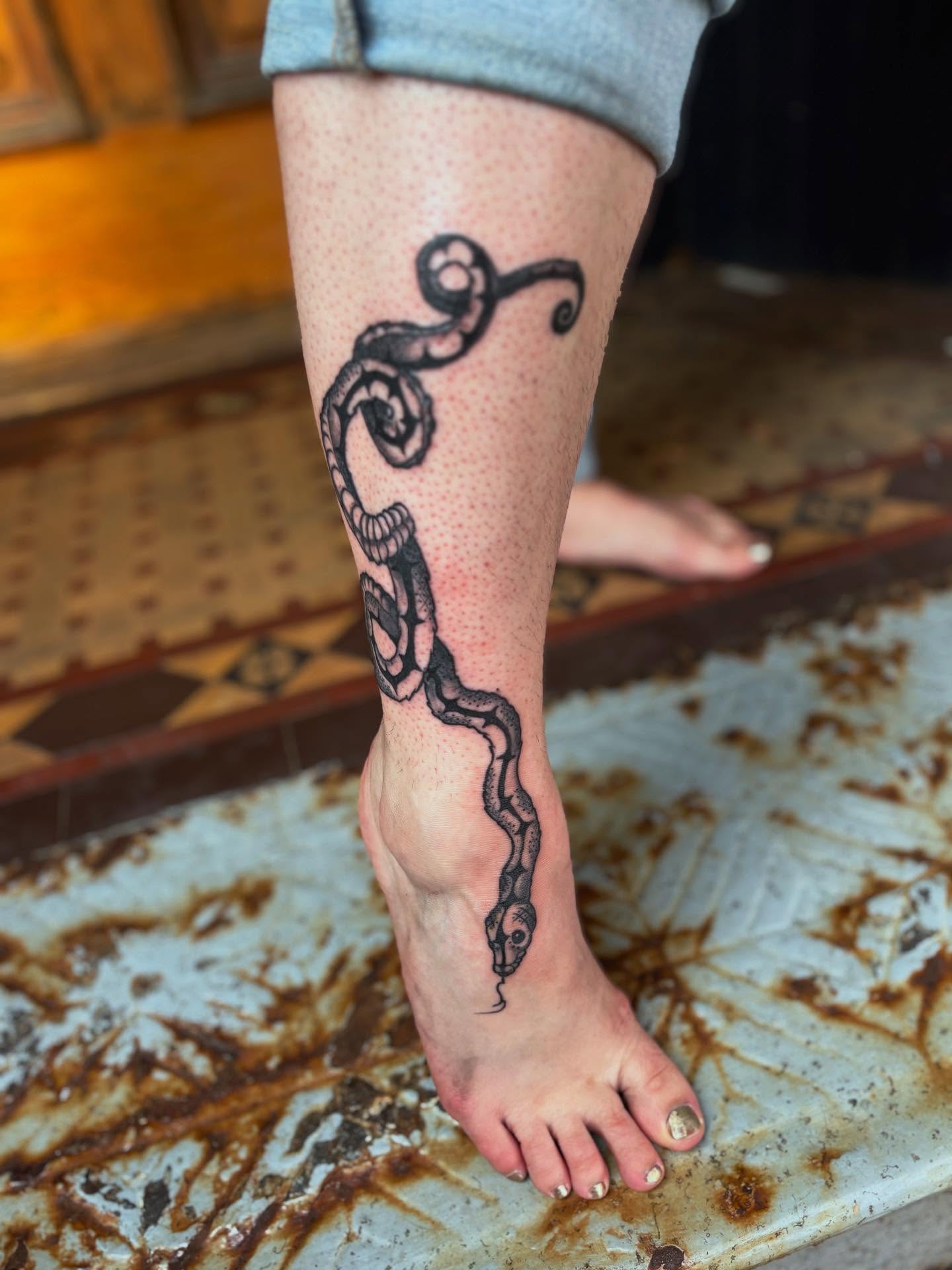 Snake dotwork tattoo on the calf by kris noble floyd