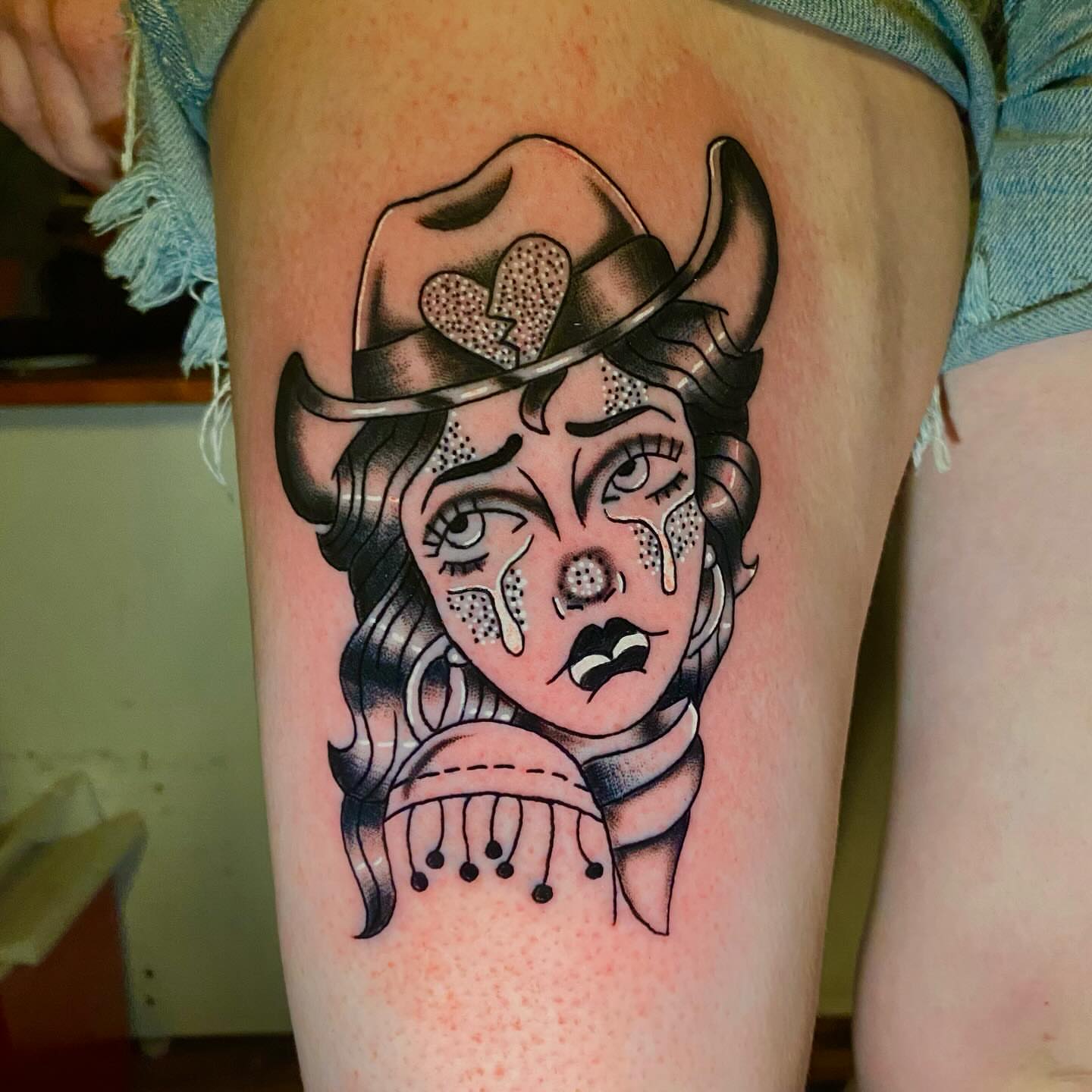 Woman with hat American traditional tattoo on the thigh by Tommy O'Connell