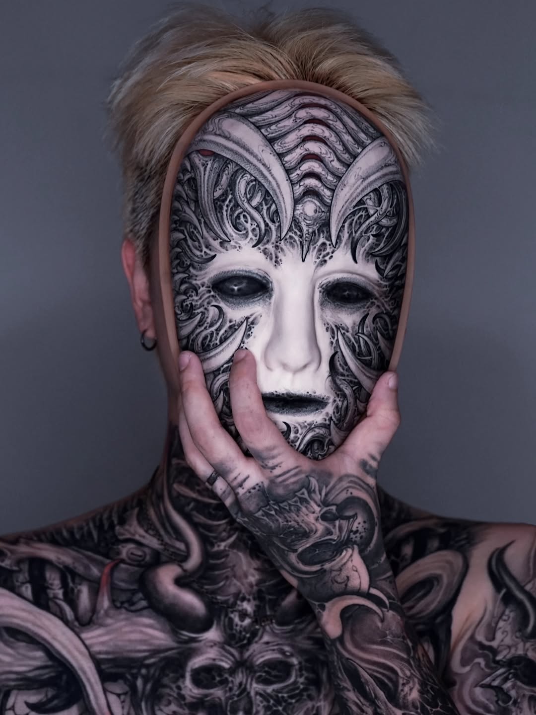 Biomechanical mask and body suit realism tattoo by Dark tattoo