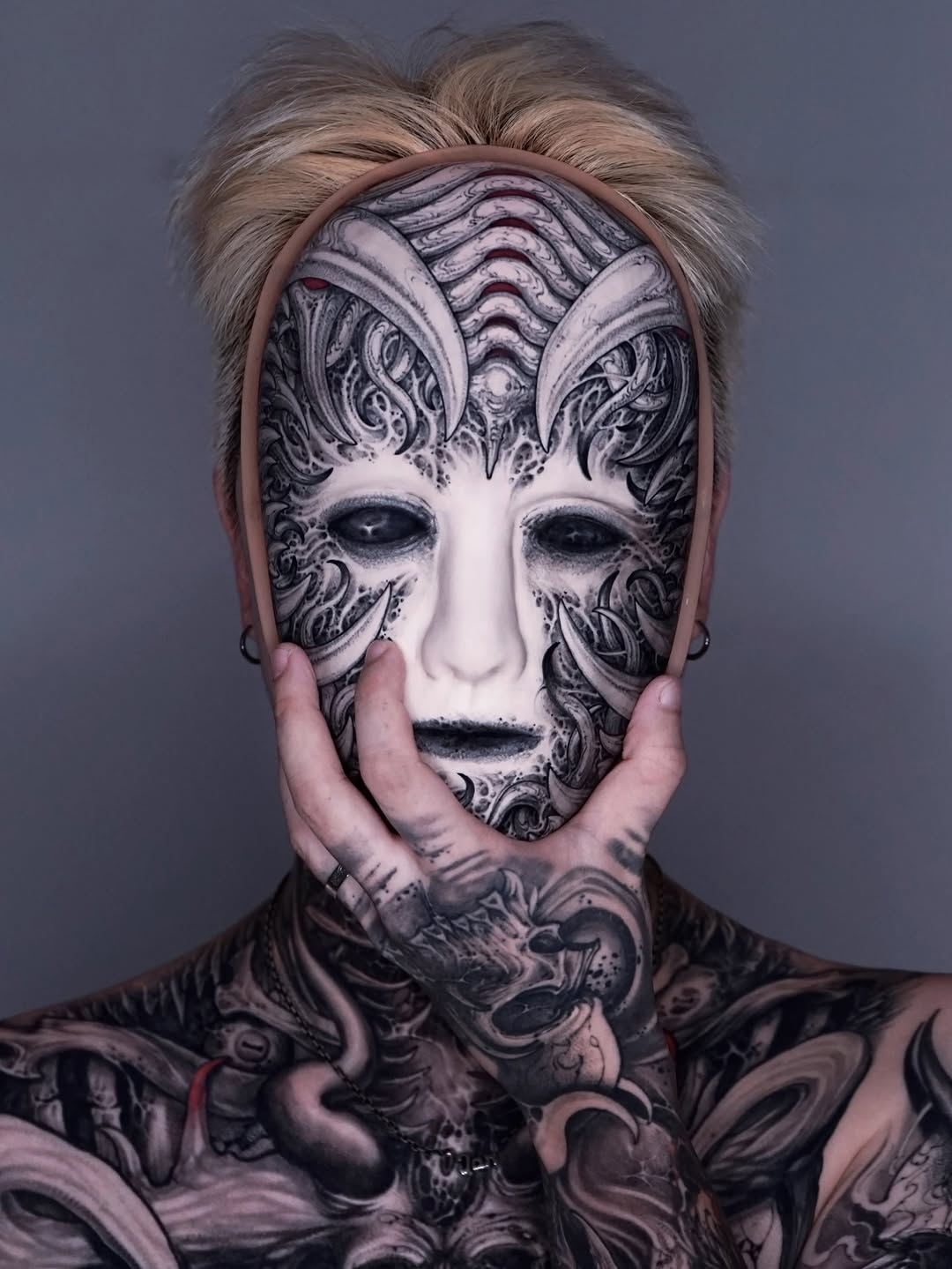 Biomechanical mask and chest piece realism tattoo by Dark tattoo